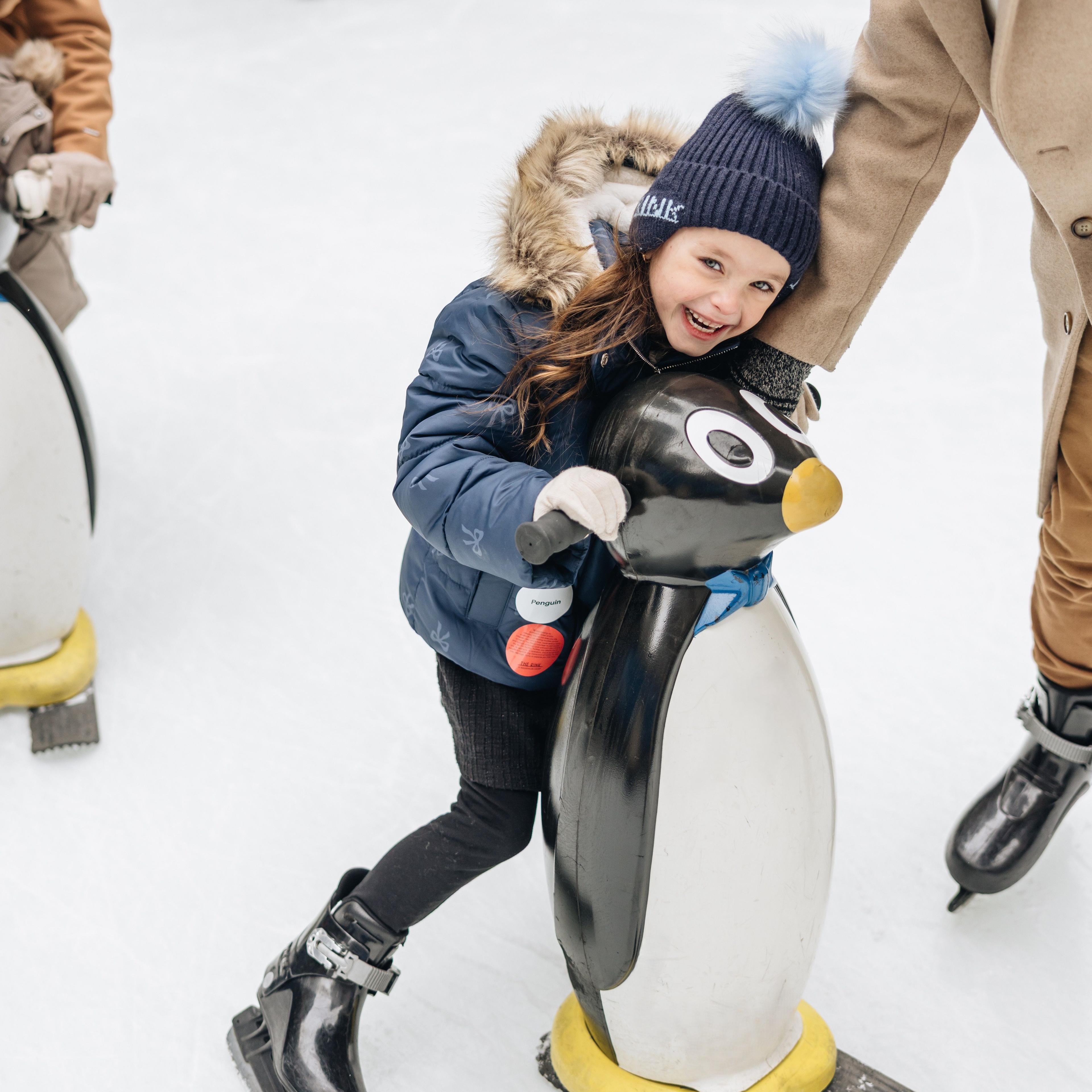 A child ice skating on The Rink at Rockefeller Center