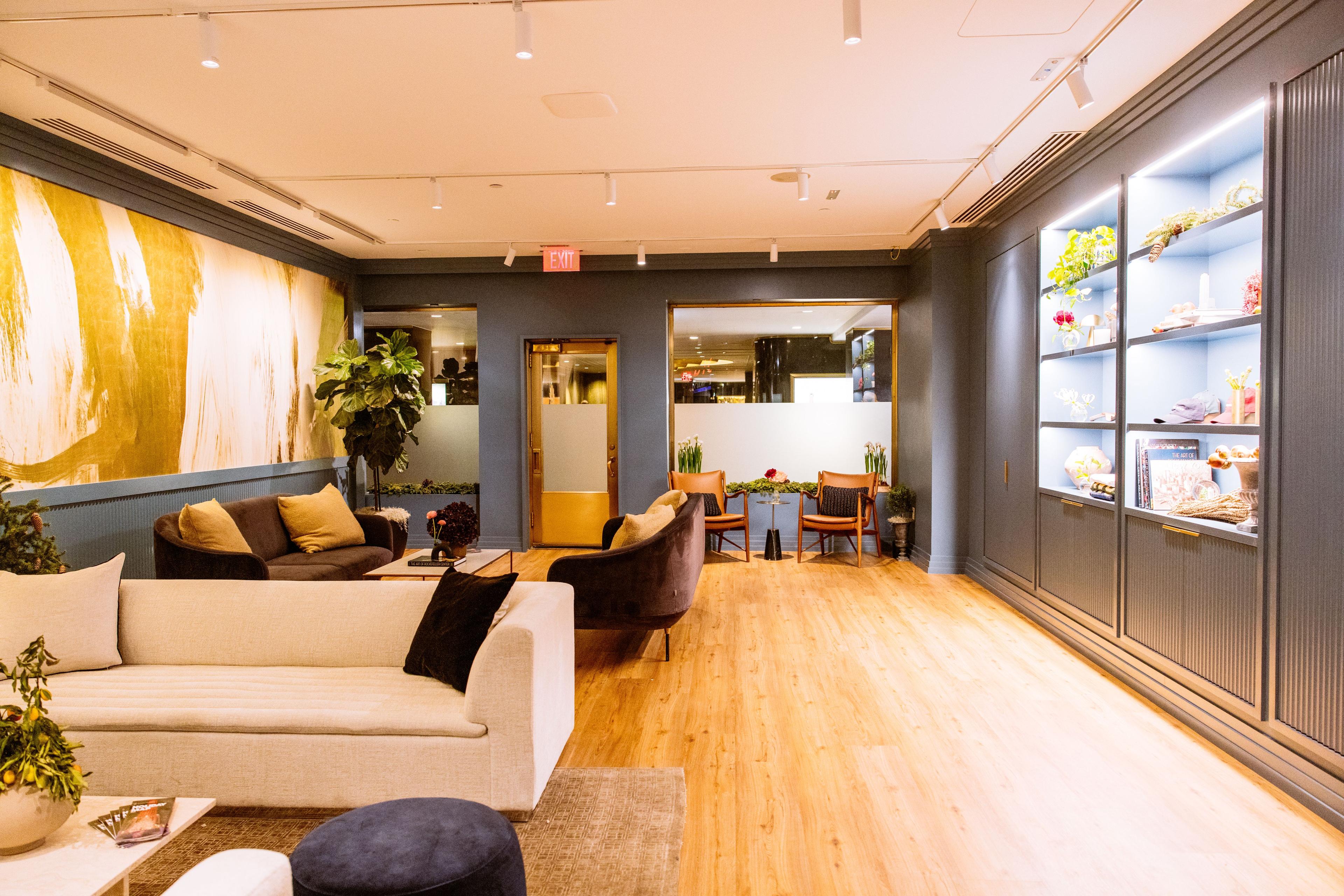lounge room with couches and tables and decor