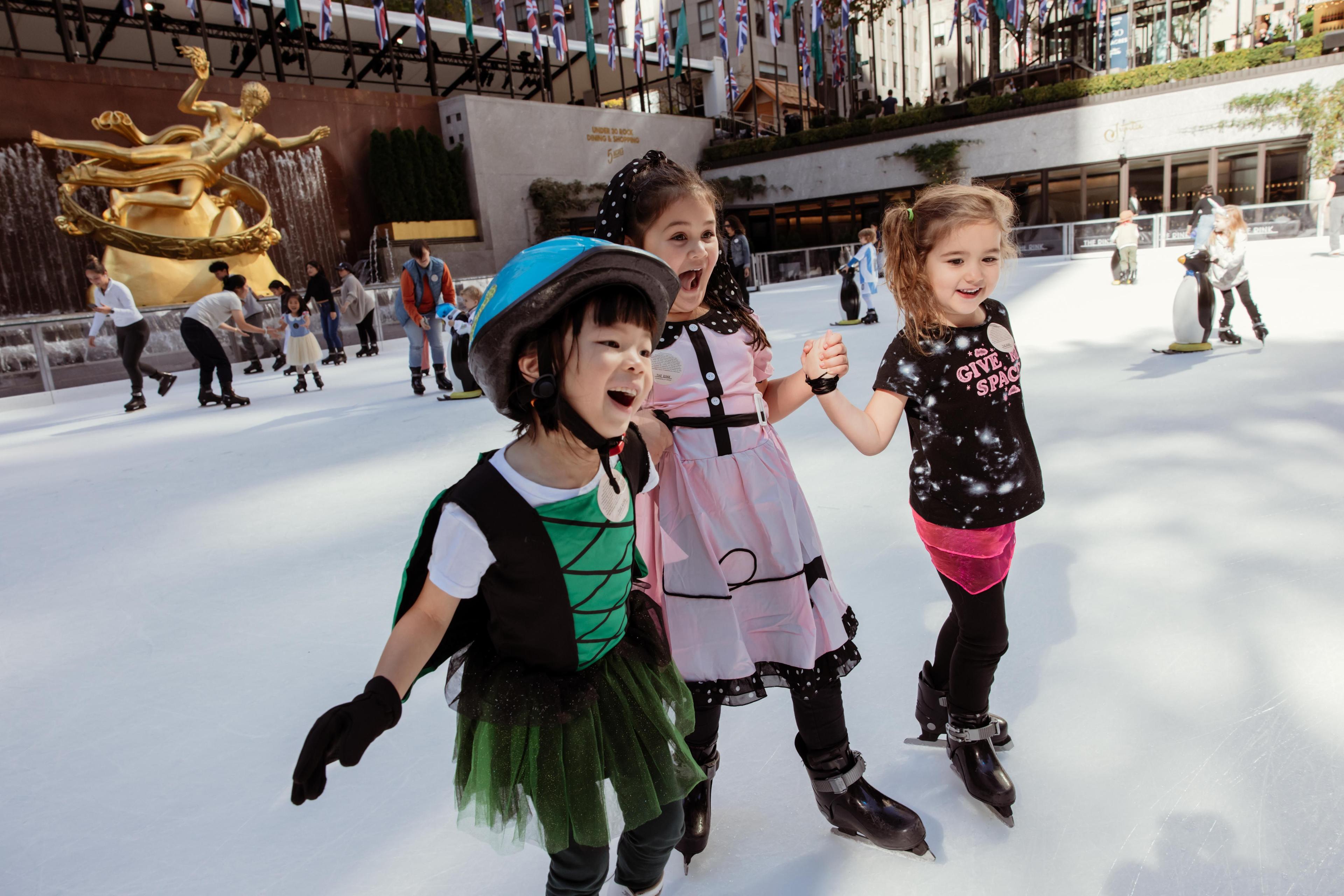 kids skating on the rink at rockefeller center