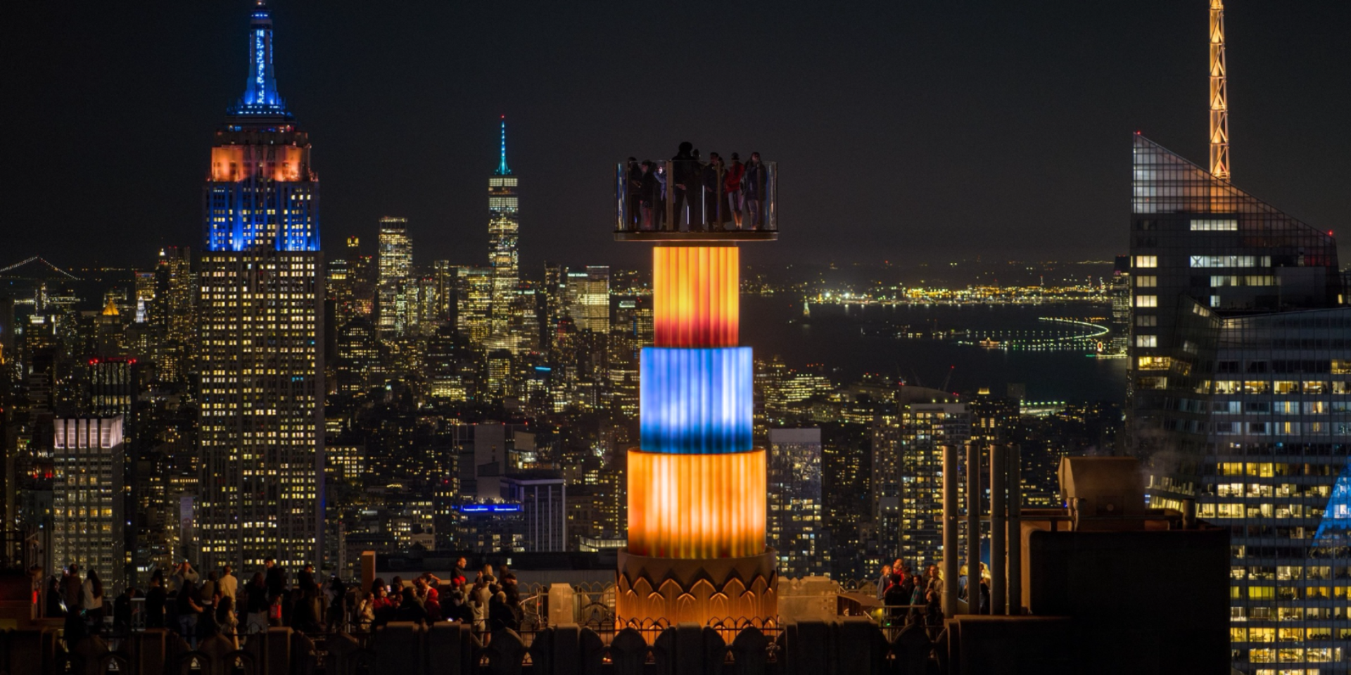 skylift lit up knicks colors at top of the rock