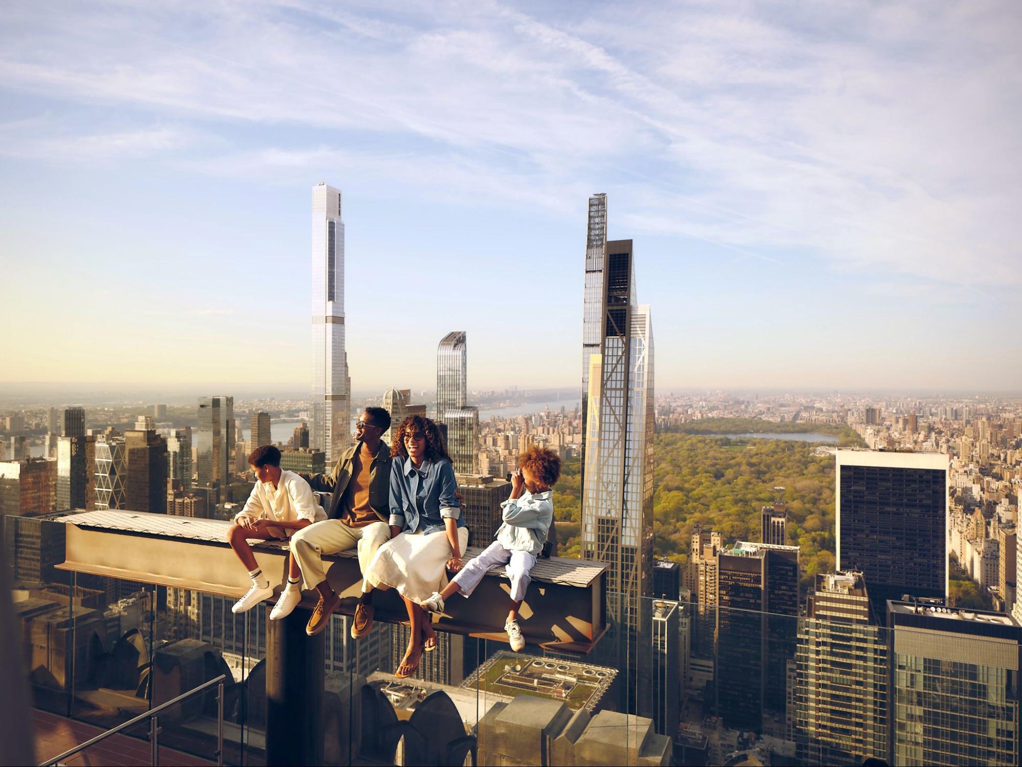a family on the beam experience at top of the rock