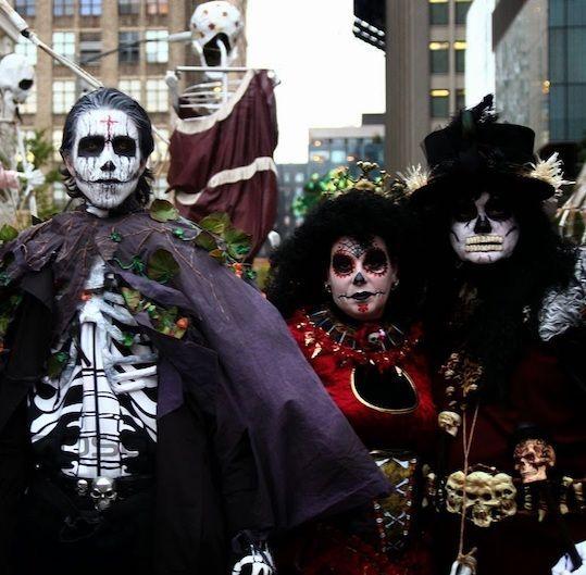 Group of people dressed in costume at the Village Halloween Parade