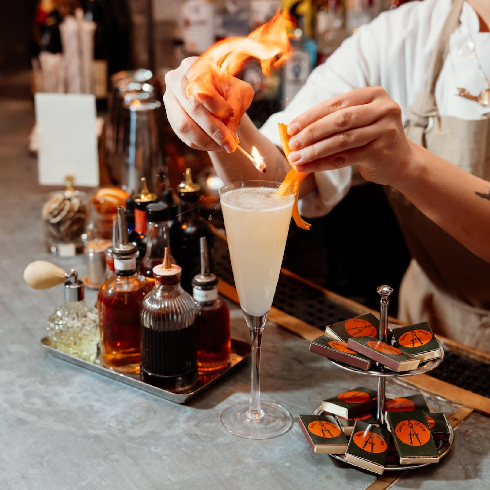 A bartender making a cocktail at Smith & Mills at Rockefeller Center