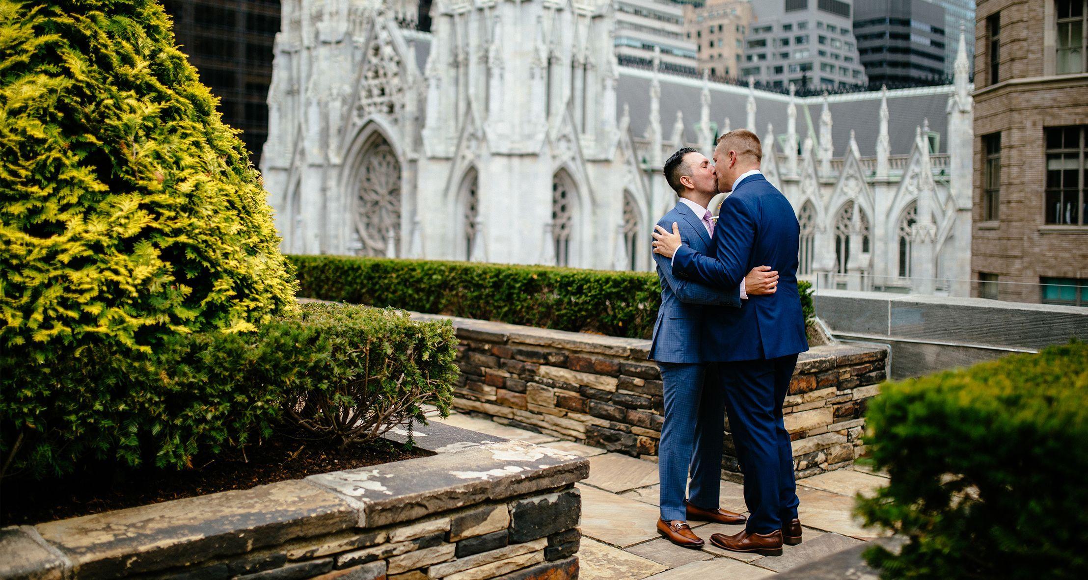 Christian and Robert sharing a kiss on their wedding day