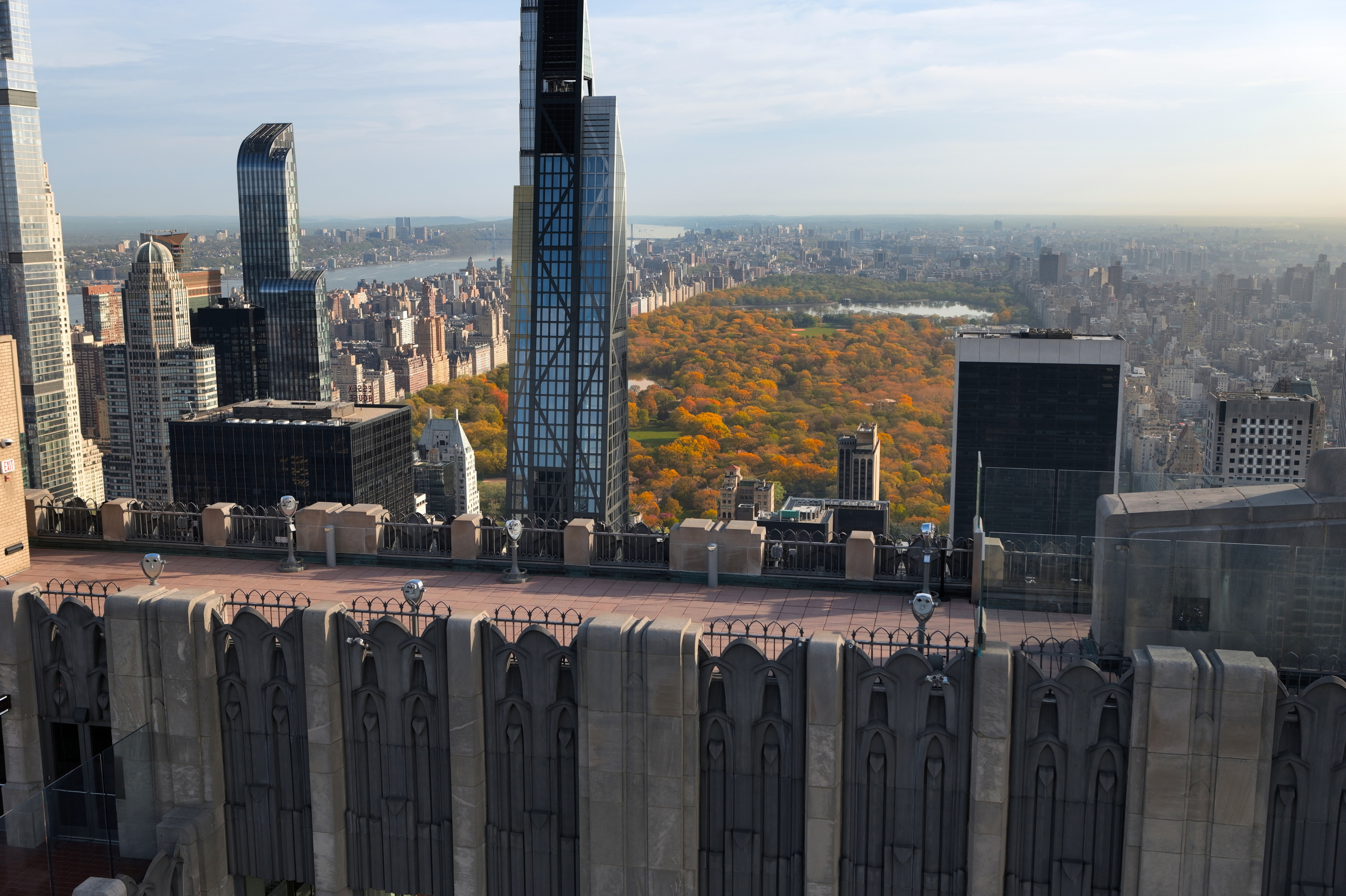 A view of the Top of the Rock observation deck with fall foliage in Central Park in the distance