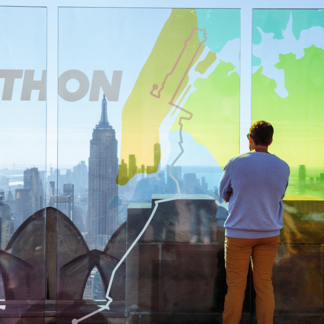 A man watching the NYC Marathon from Top of the Rock