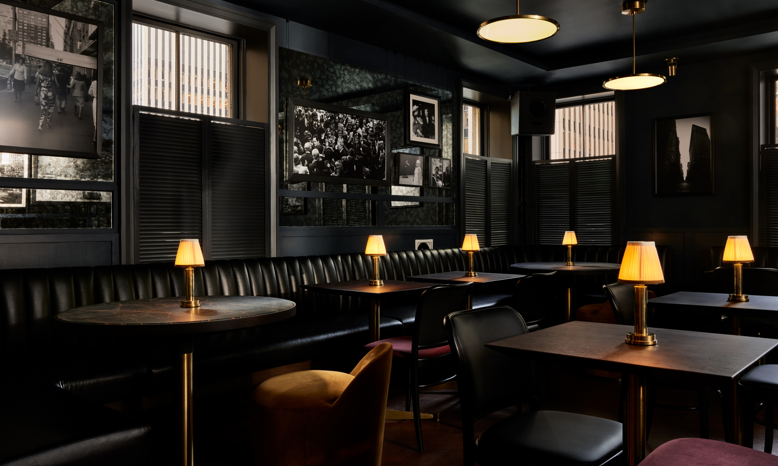 Tables, chairs, and booth seating on Pebble Bar's third floor