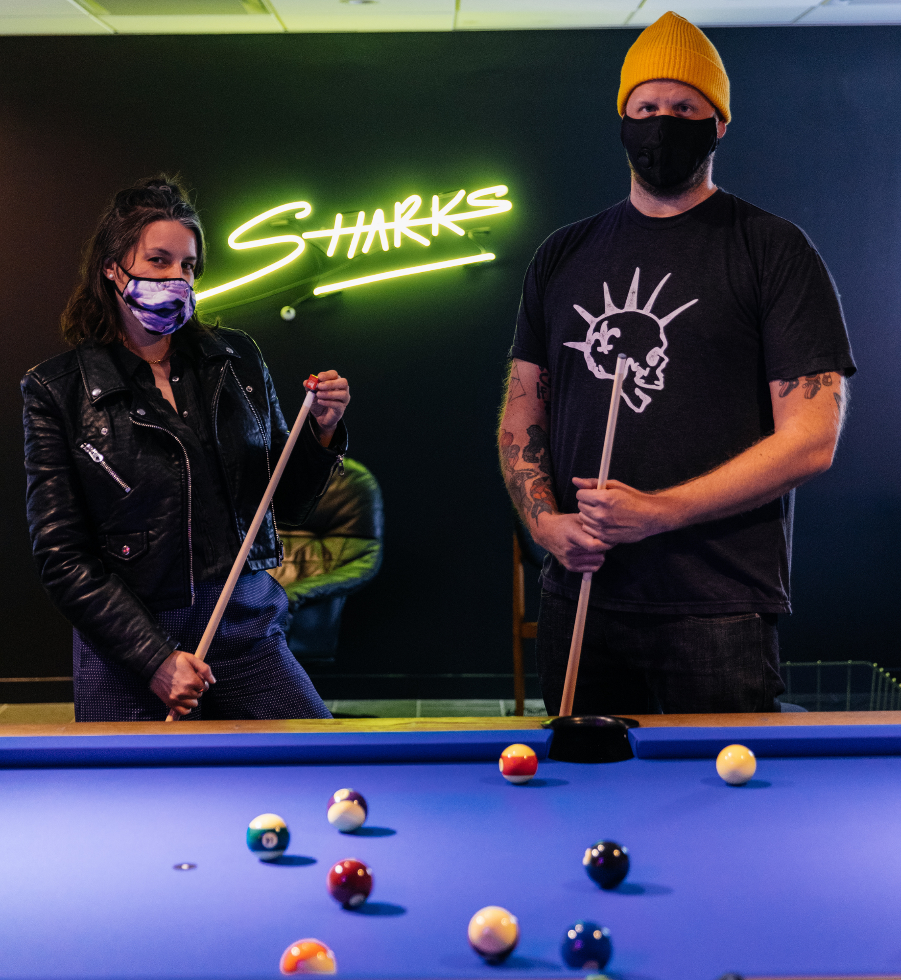Sharks Pool Club CEO Jessica Resler and COO Dusty Hollensteiner playing pool at the Sharks Pool Club in Rockefeller Center.