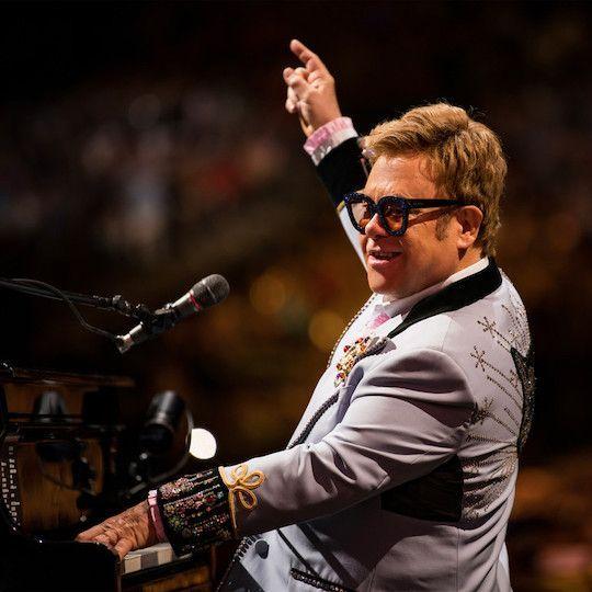 Elton John playing the piano