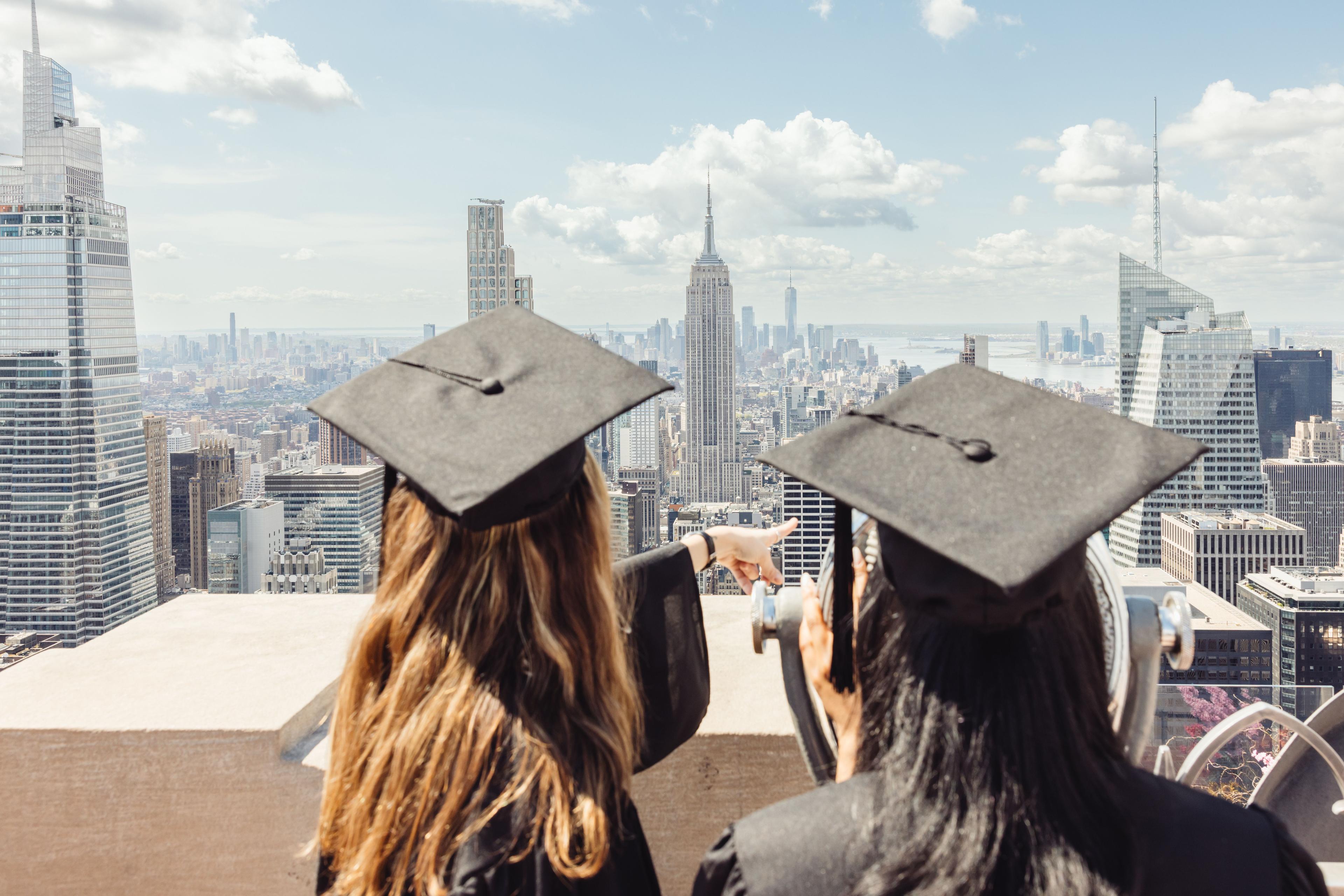 two graduates at top of the rock
