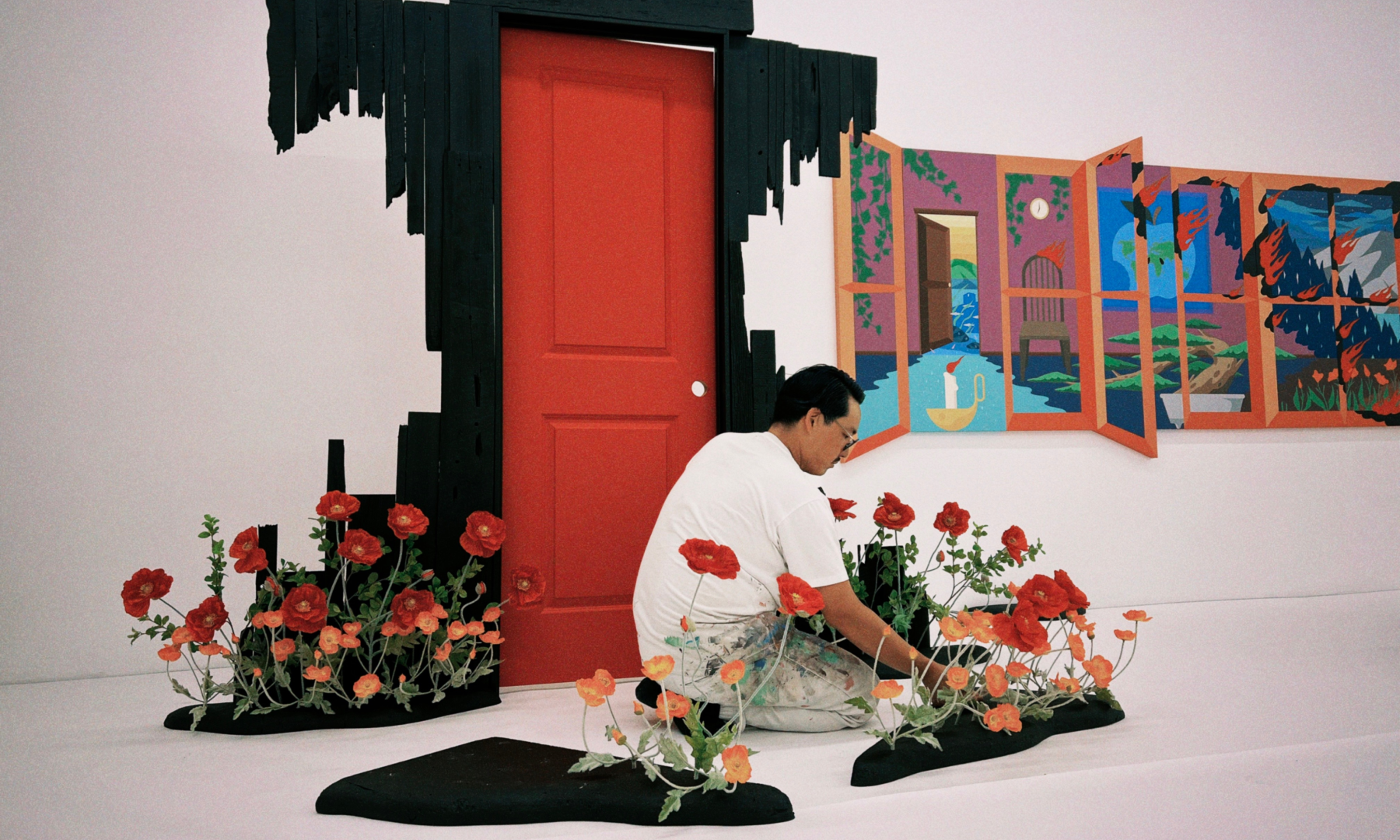 Artist Greg Ito preparing his floral artwork in his studio