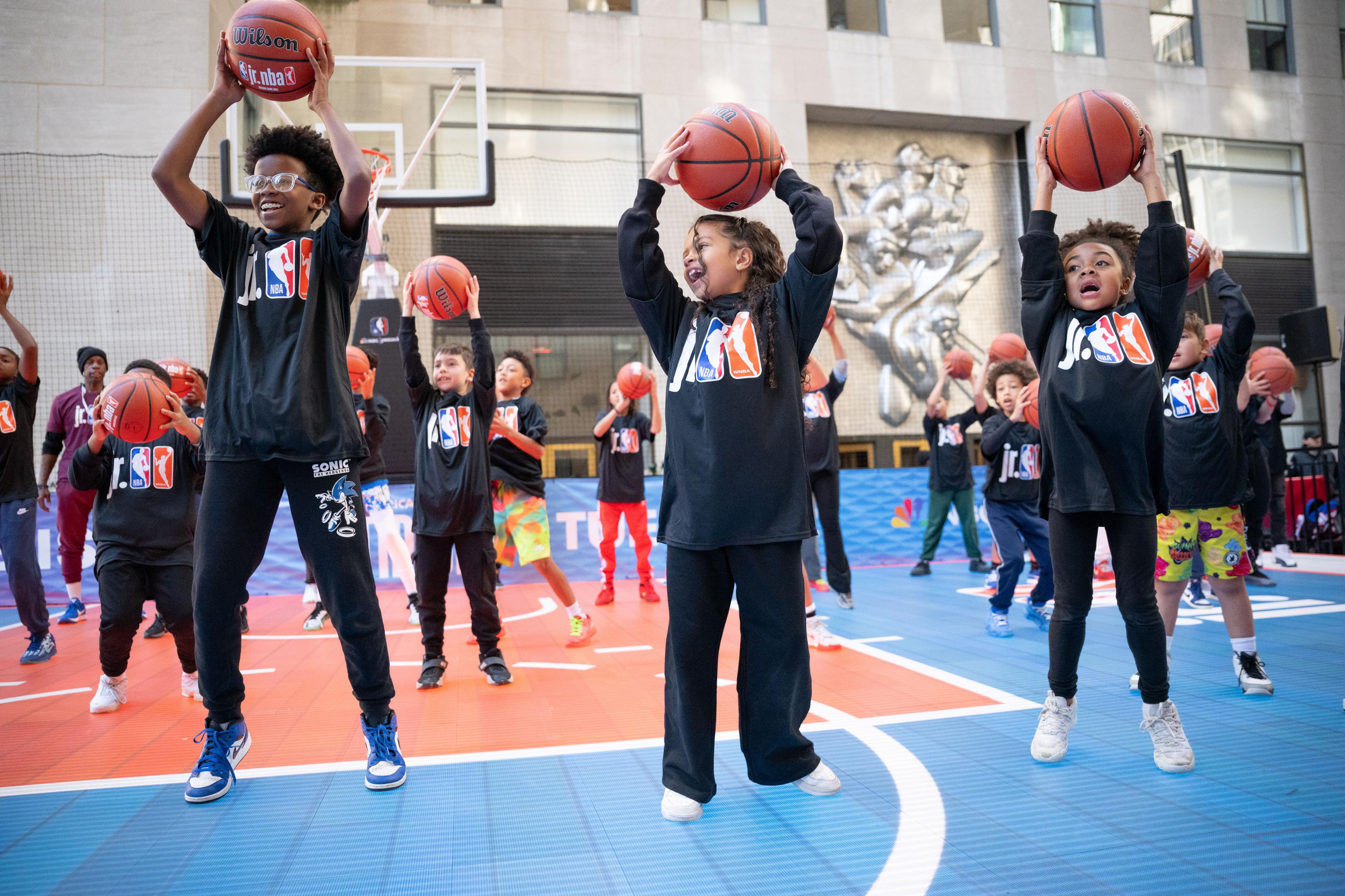 people playing basketball at rockefeller center