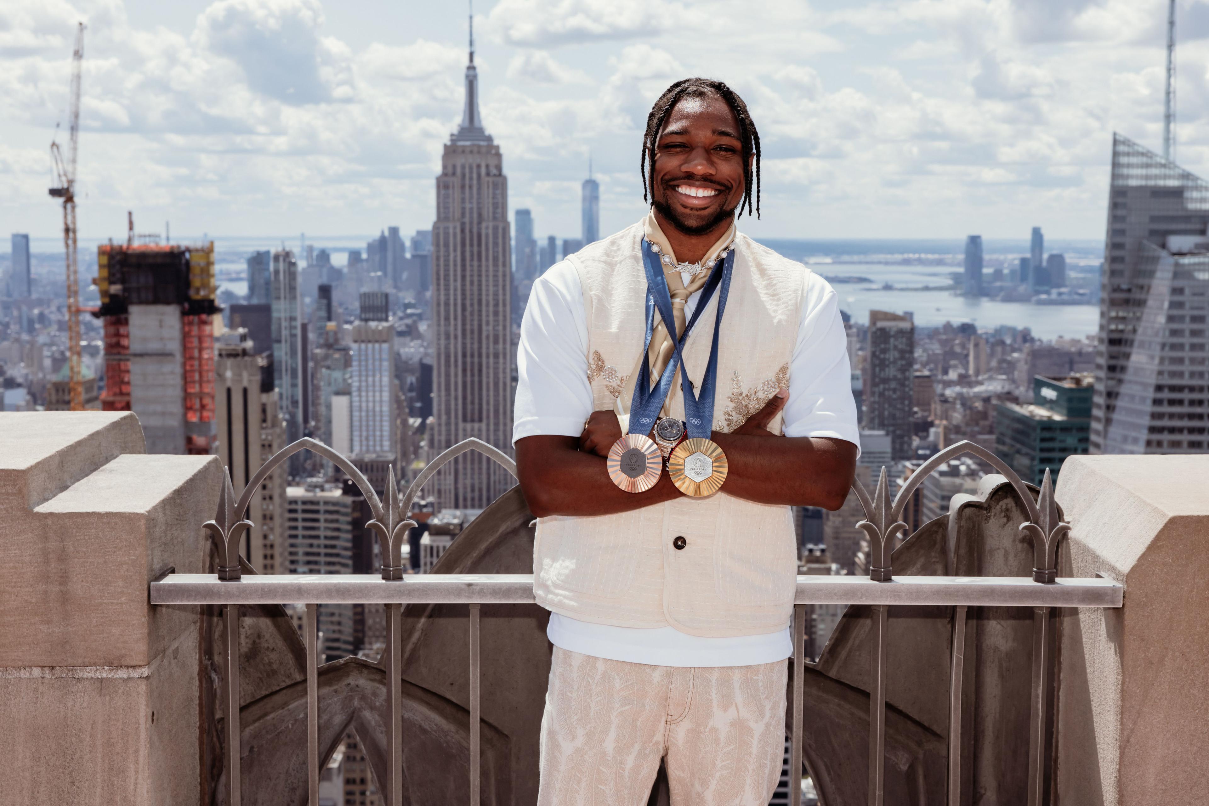 noah lyles at top of the rock