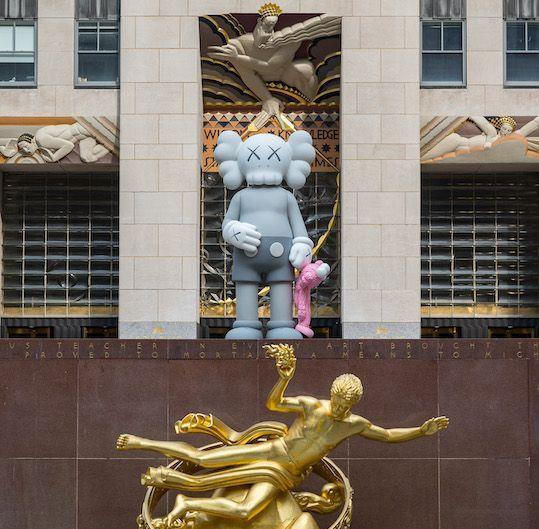 SHARE sculpture by artist KAWS on Center Plaza