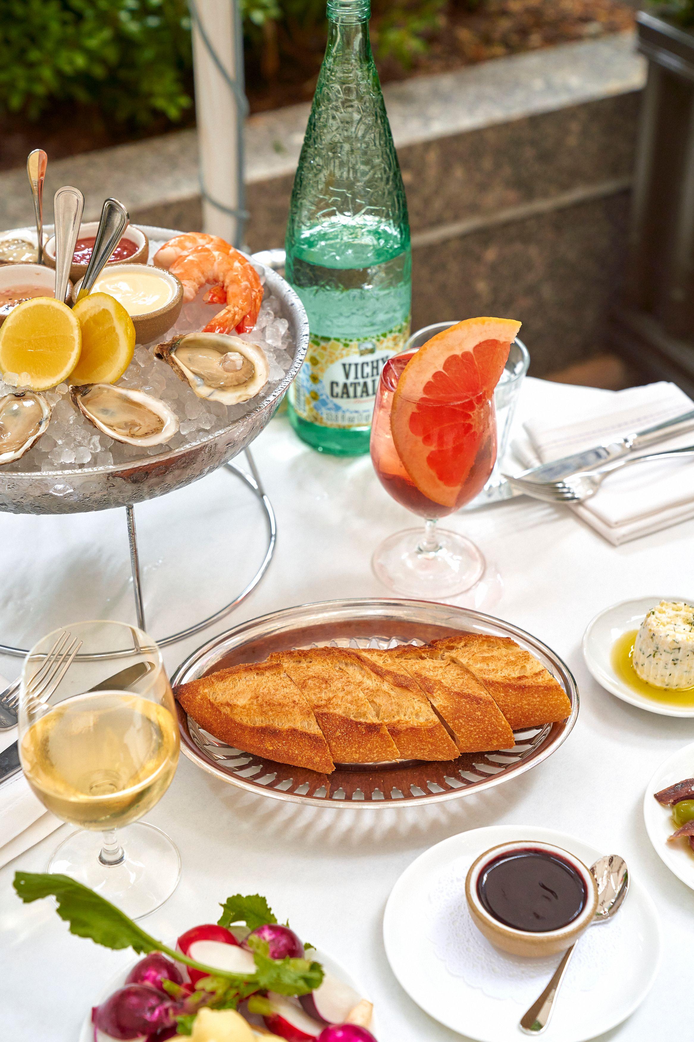 oysters, bread, wine, and cocktails from le rock