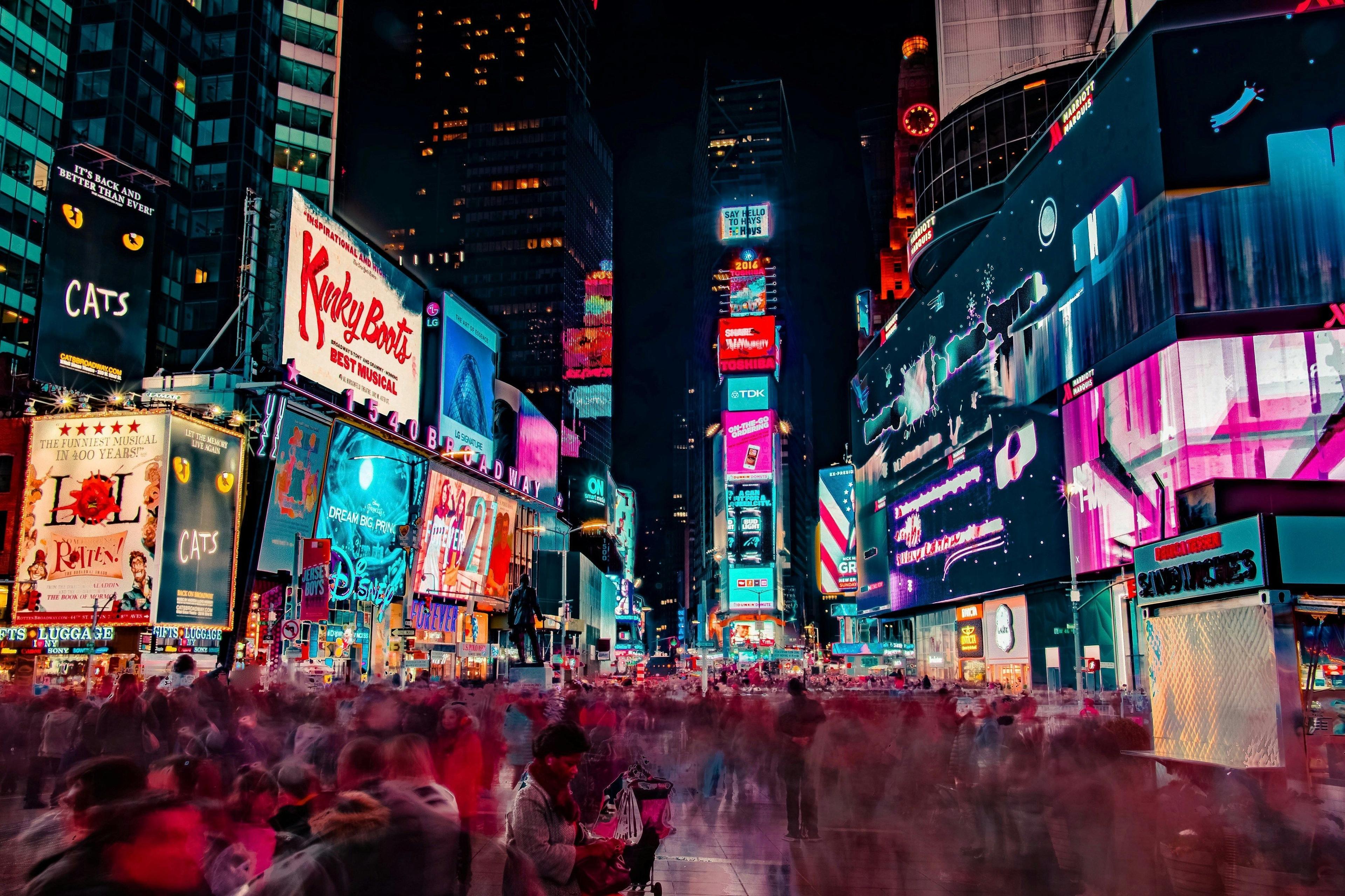 Long-exposure image of crowds in Times Square at night