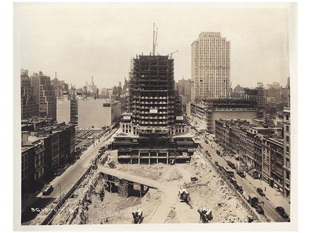 A black and white photo depicting the construction of Rockefeller Center.