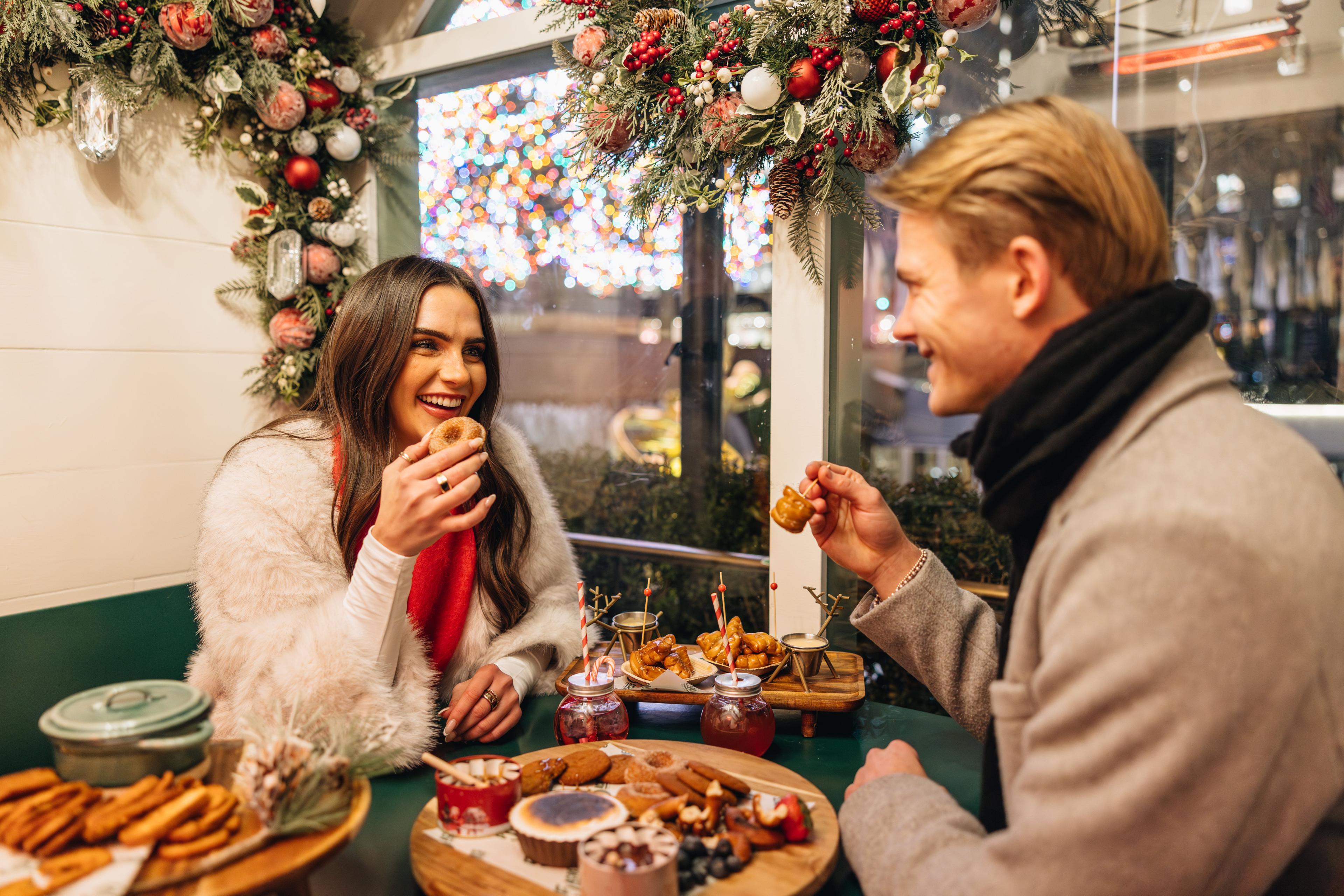 Couple enjoying food at The Rink