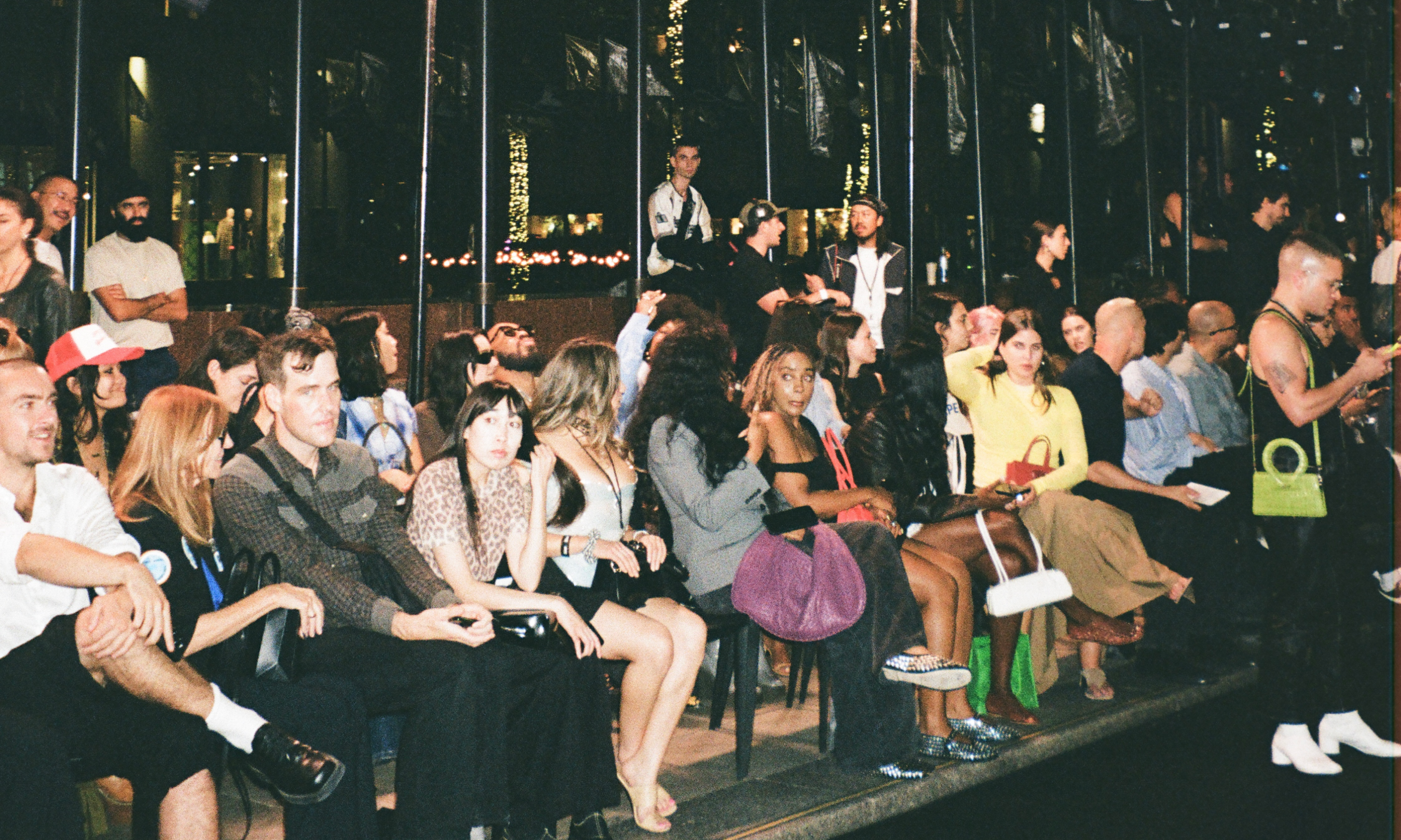 Spectators sitting in chairs during LUAR's 2024 NYFW show at Rockefeller Center