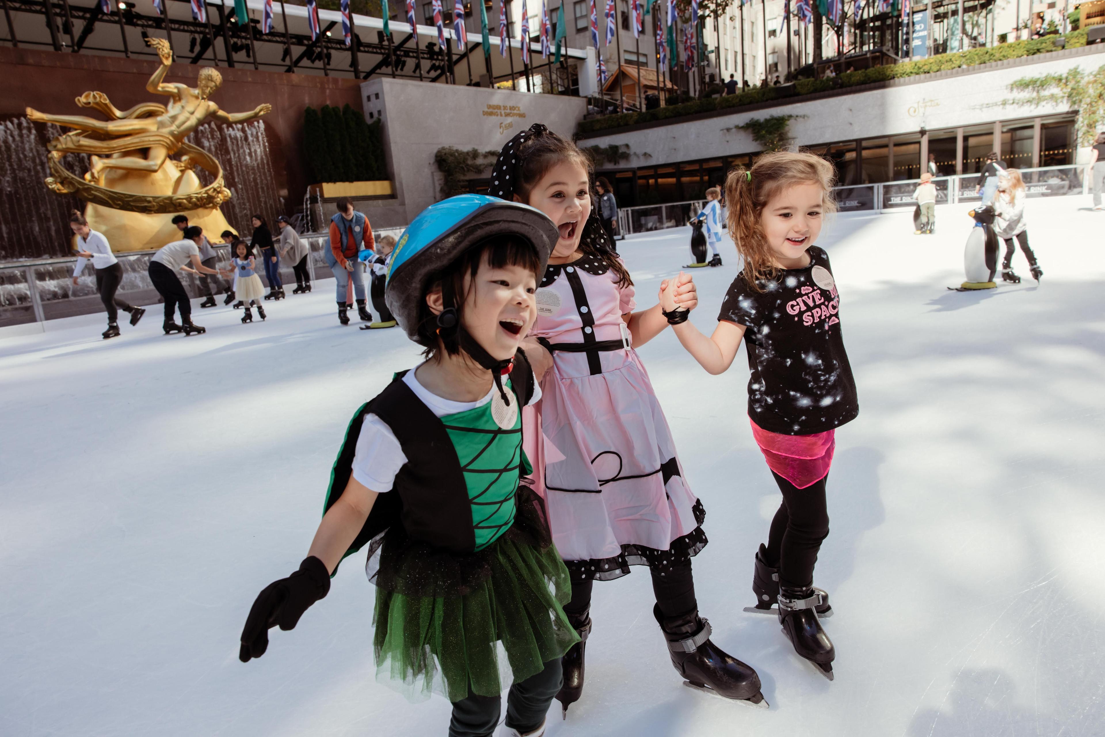 kids skating on the rink at rockefeller center