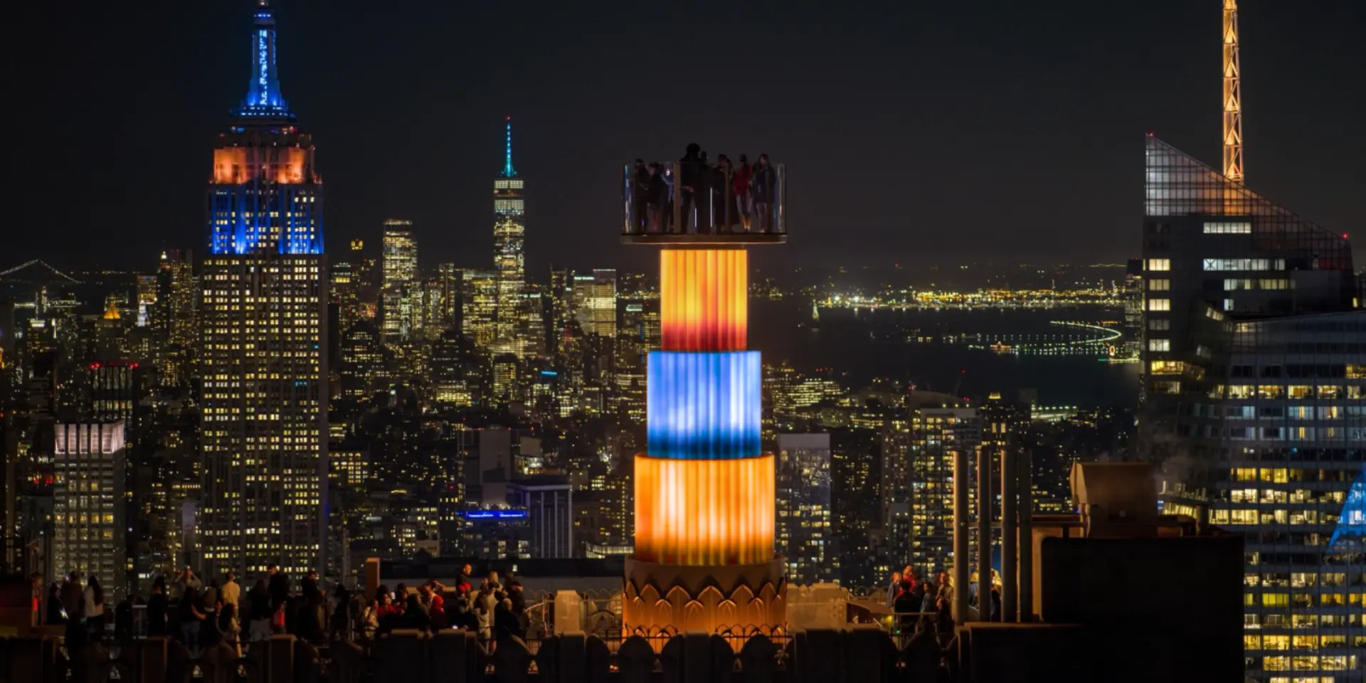 skylift lit up knicks colors at top of the rock