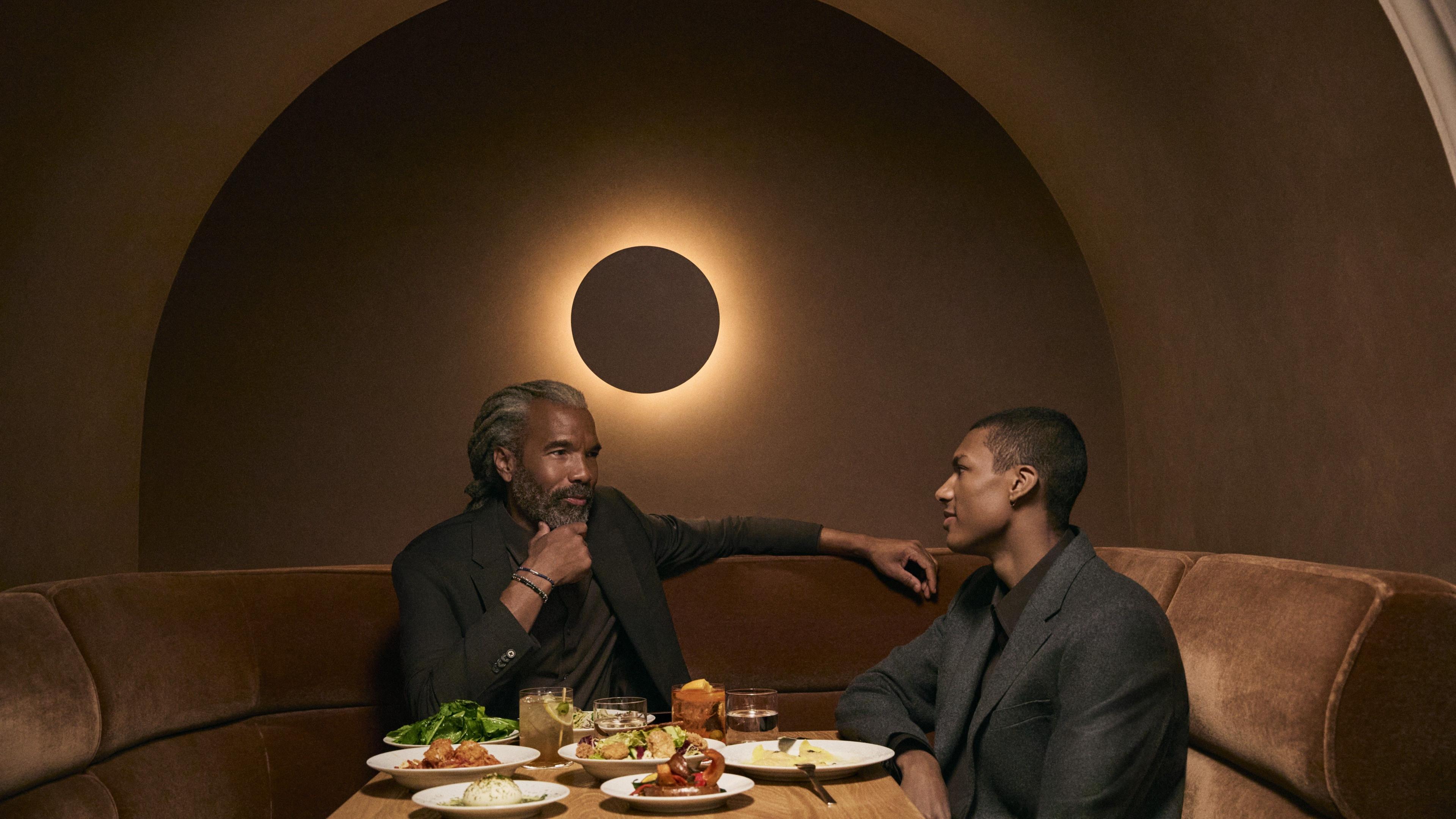 two men enjoying a meal at jupiter