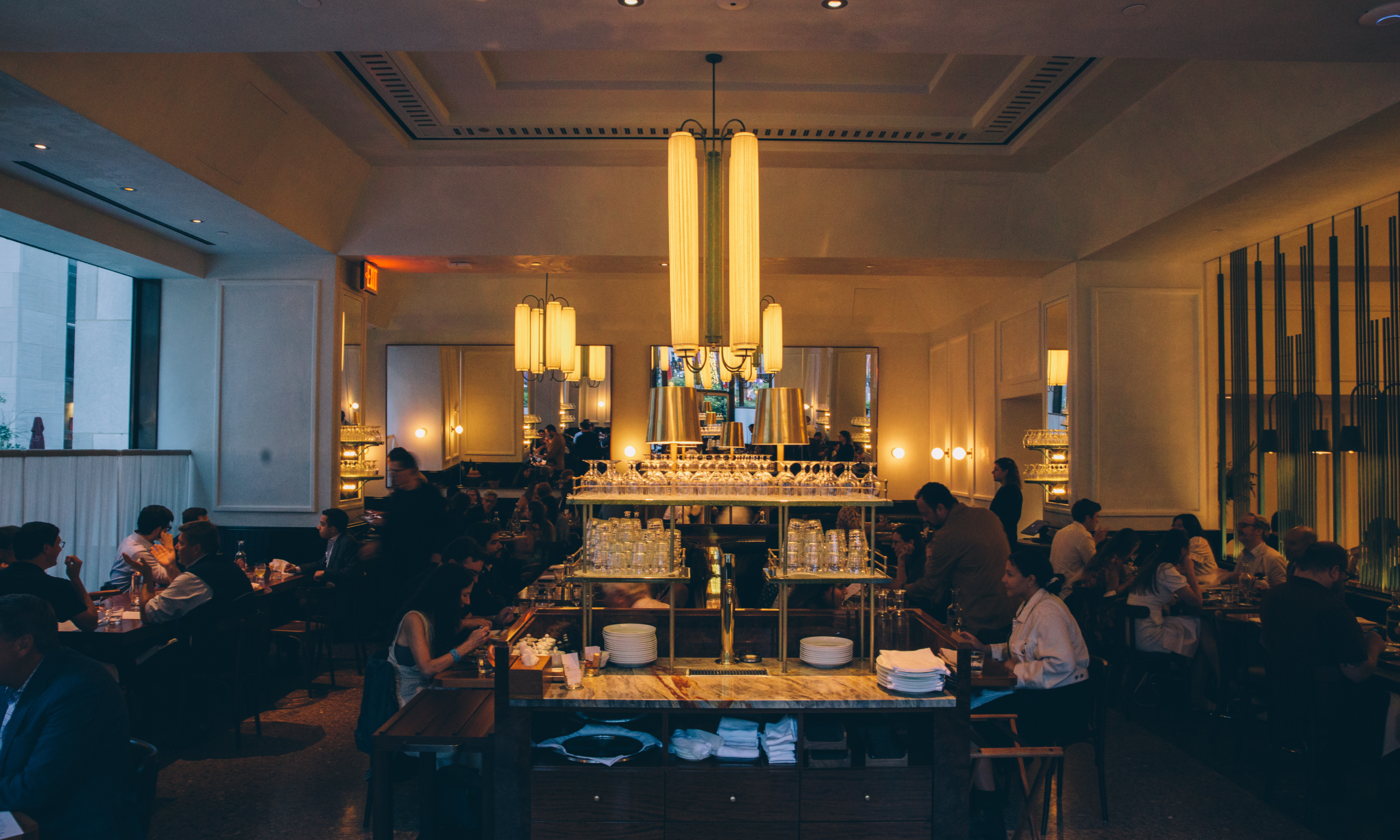 People seated at tables at Le Rock at Rockefeller Center