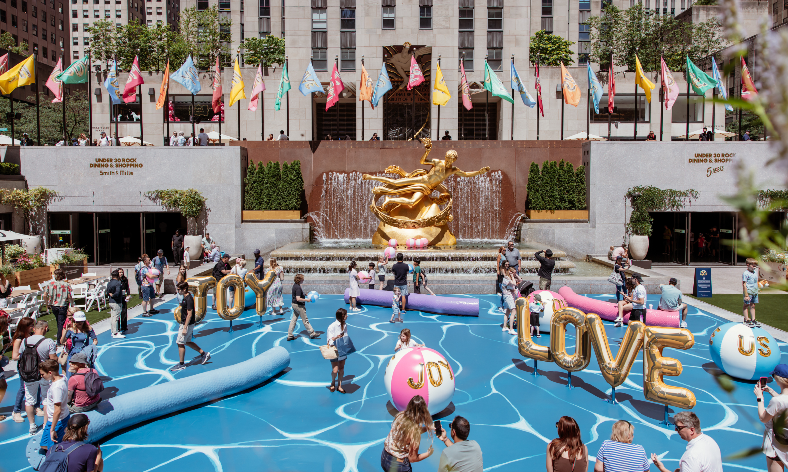 Aerial view of people interacting with artist Joel Mesler's "Pool Party," an immersive public art installation at The Rink