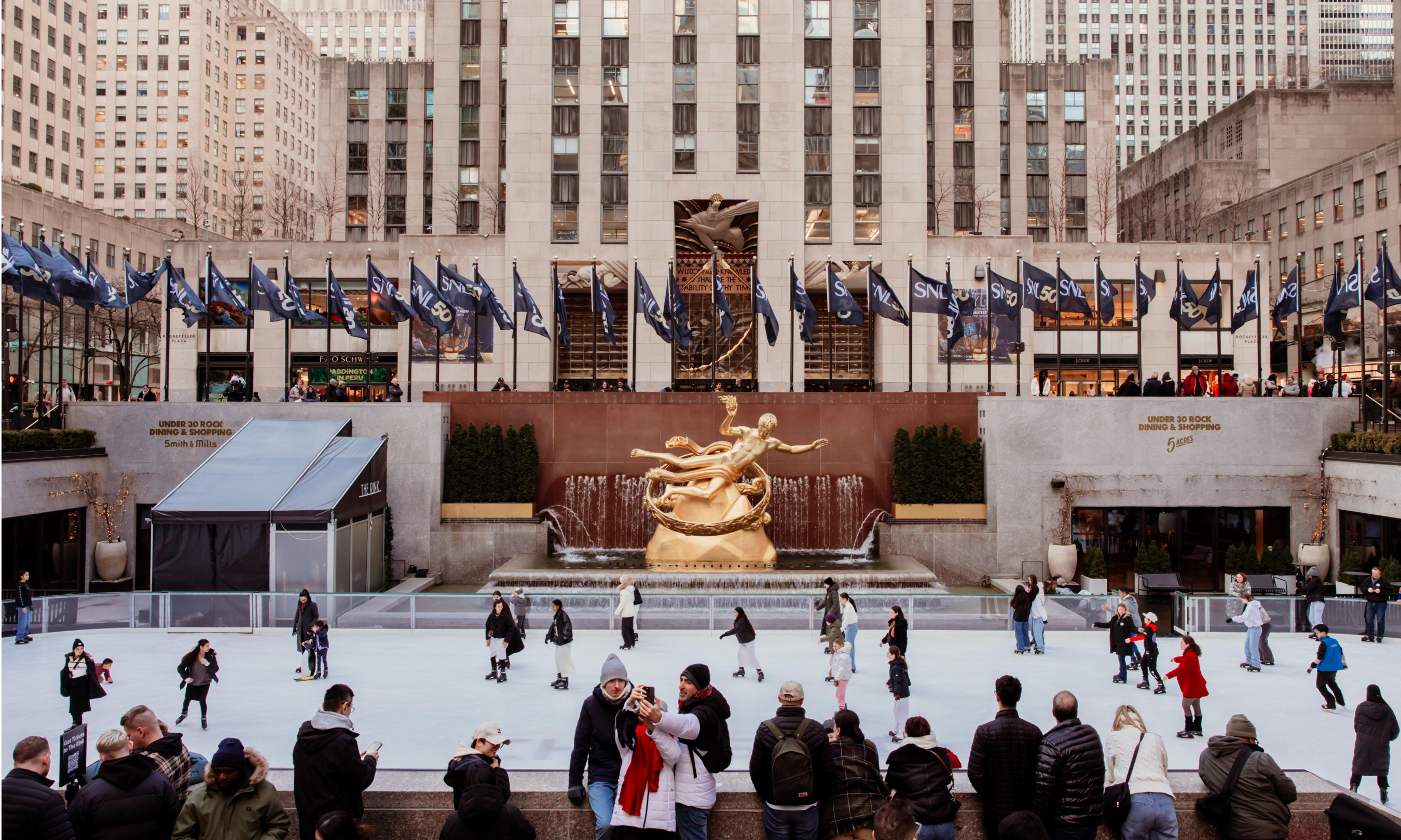 An aerial view of people ice skating on The Rink at Rockefeller Center Presented by Chase Freedom