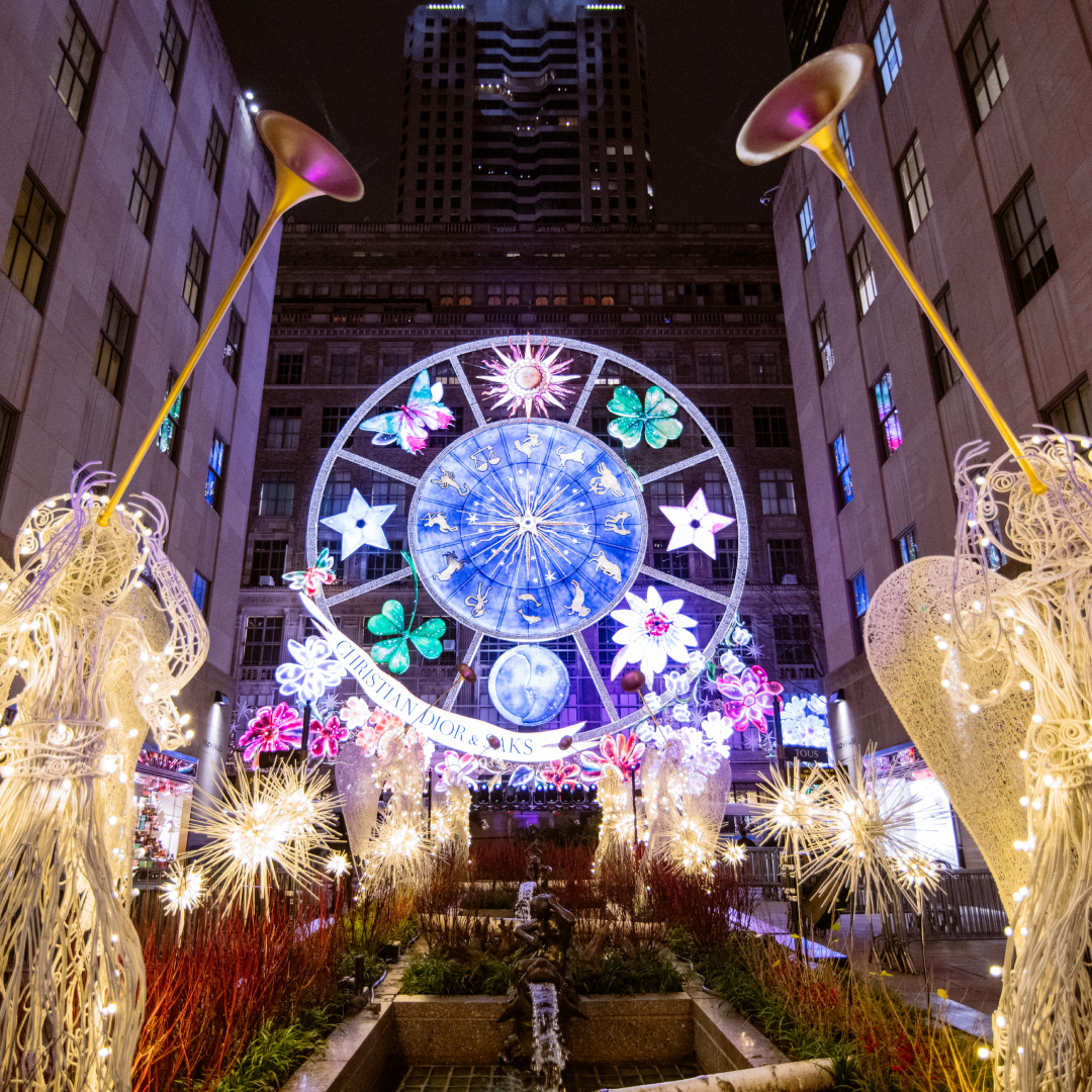 The view of the Saks Fifth Avenue Holiday Light Show from the Channel Gardens at Rockefeller Center