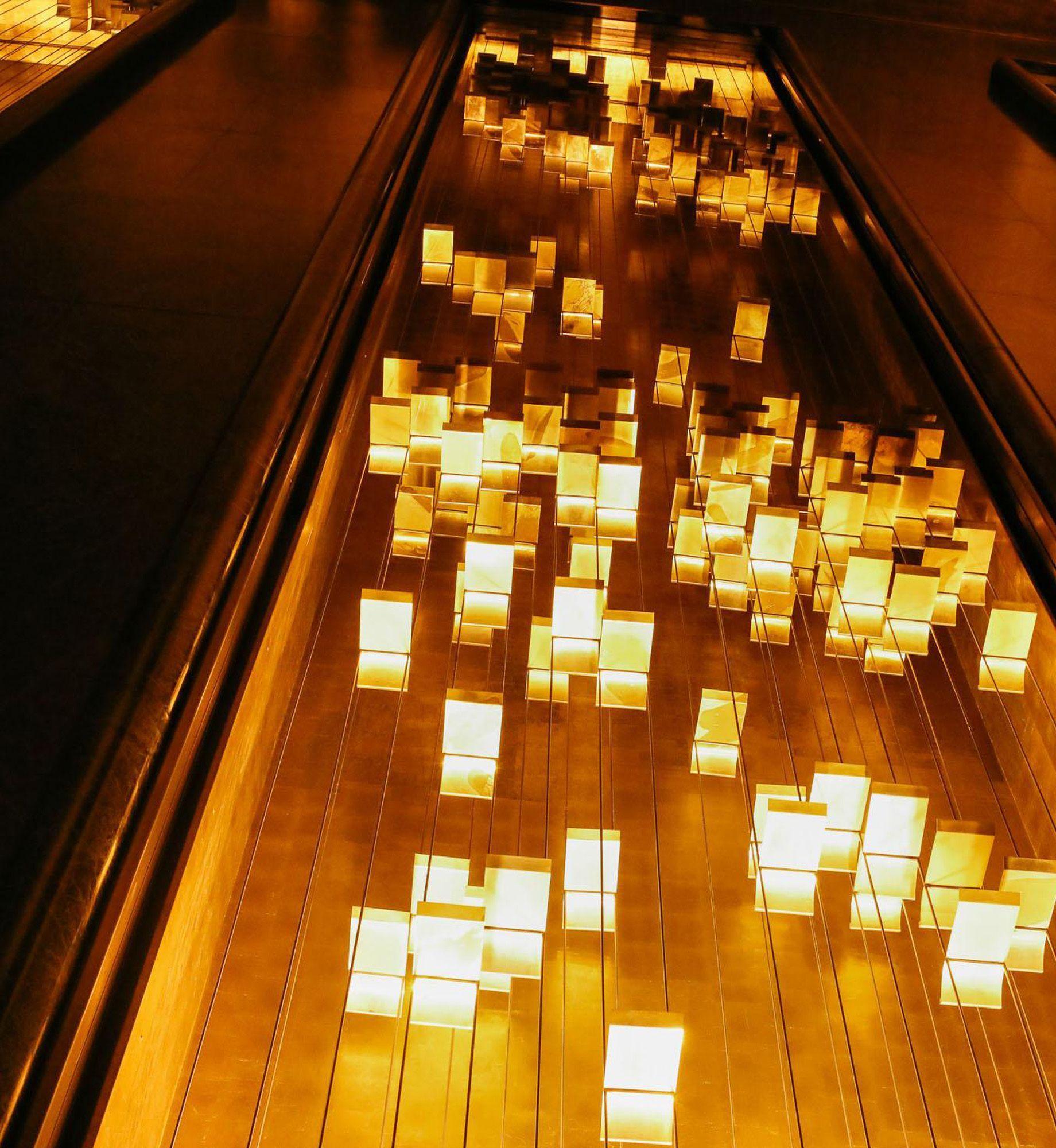 A photo of Michio Ihara's sculpture named Light and Movement inside the Rockefeller International Building in New York City.