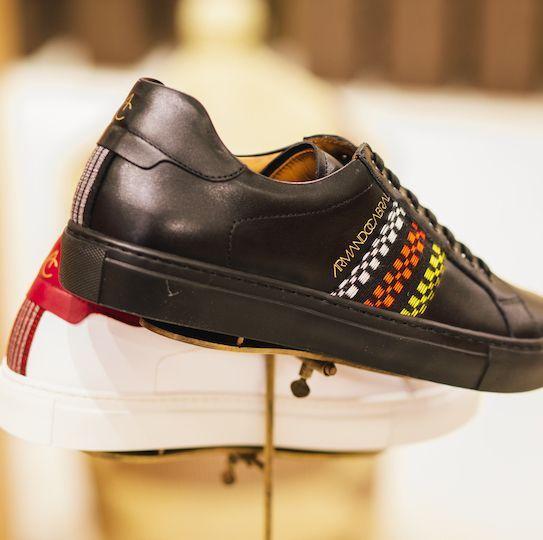 A black sneaker designed by Armando Cabral