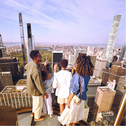 a family at top of the rock
