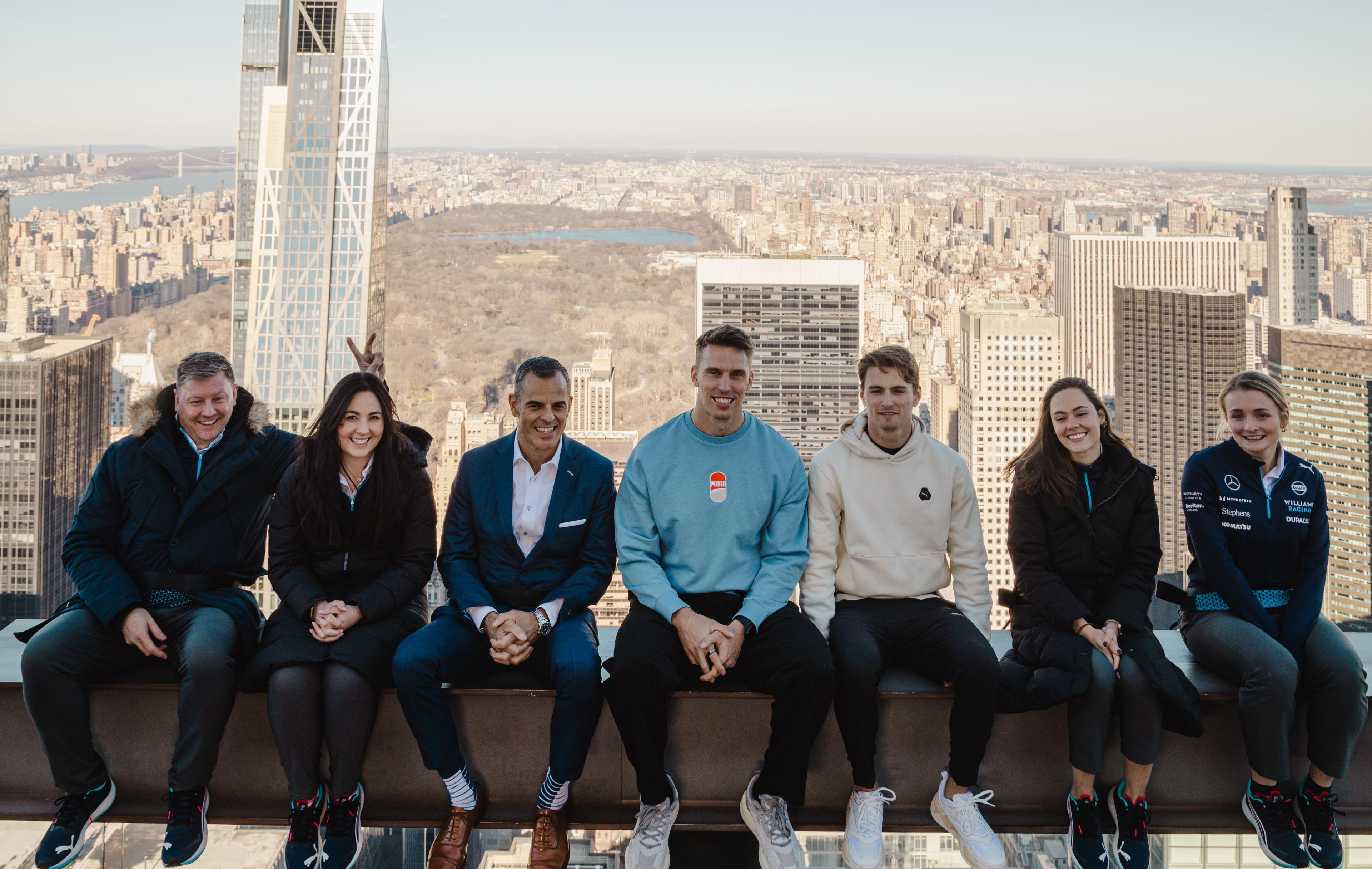 Atlassian Williams F1 Team on the beam at top of the rock