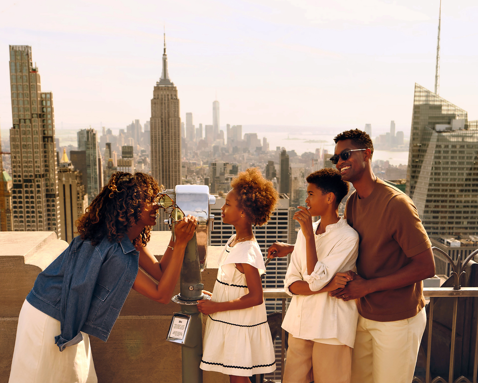 a family at top of the rock
