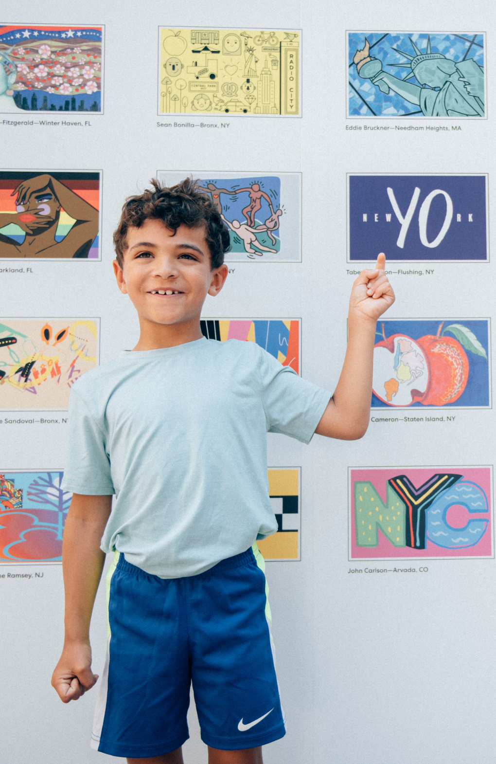 Little boy pointing out his parent's "New York" flag design