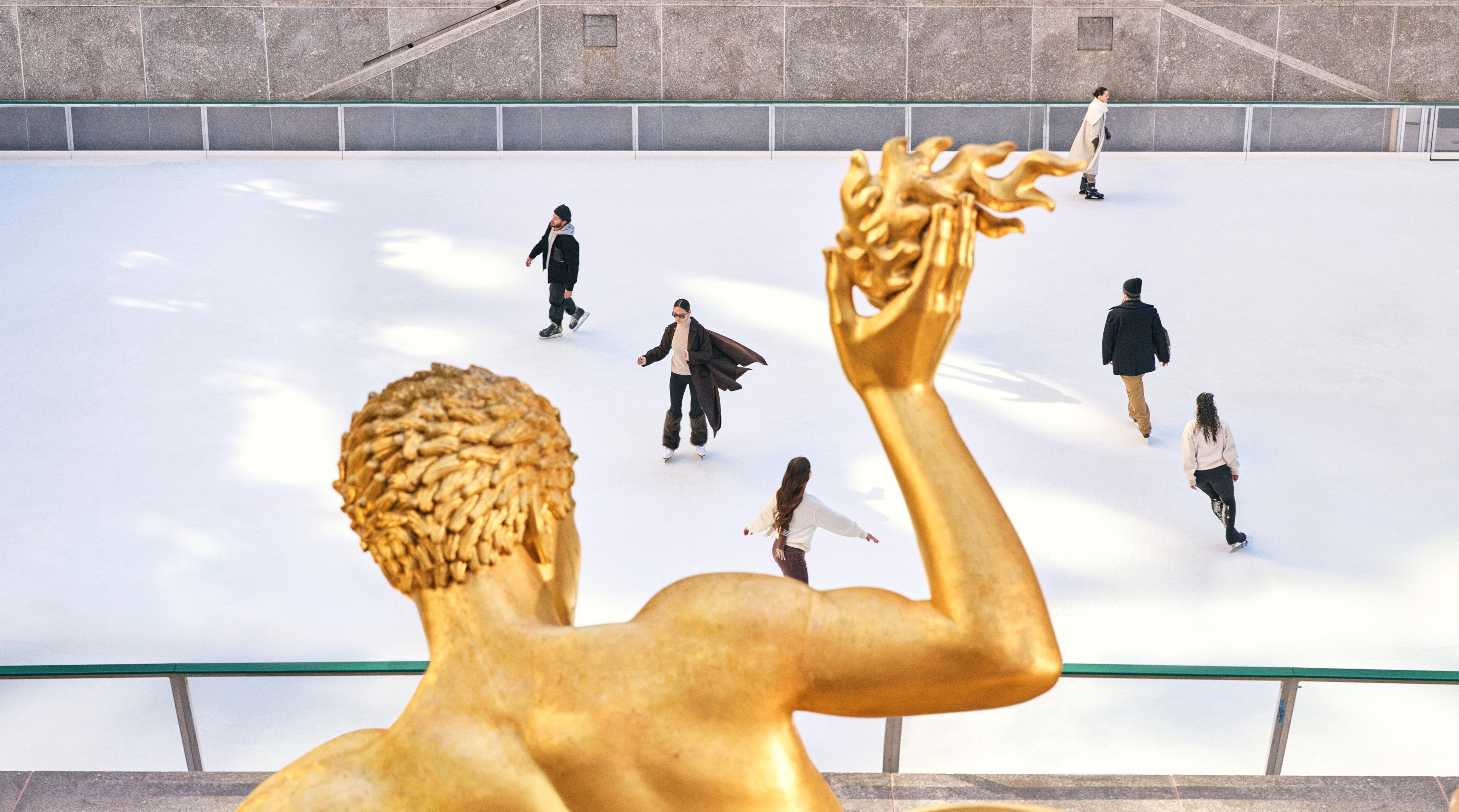 ice skaters at the rink at rockefeller center