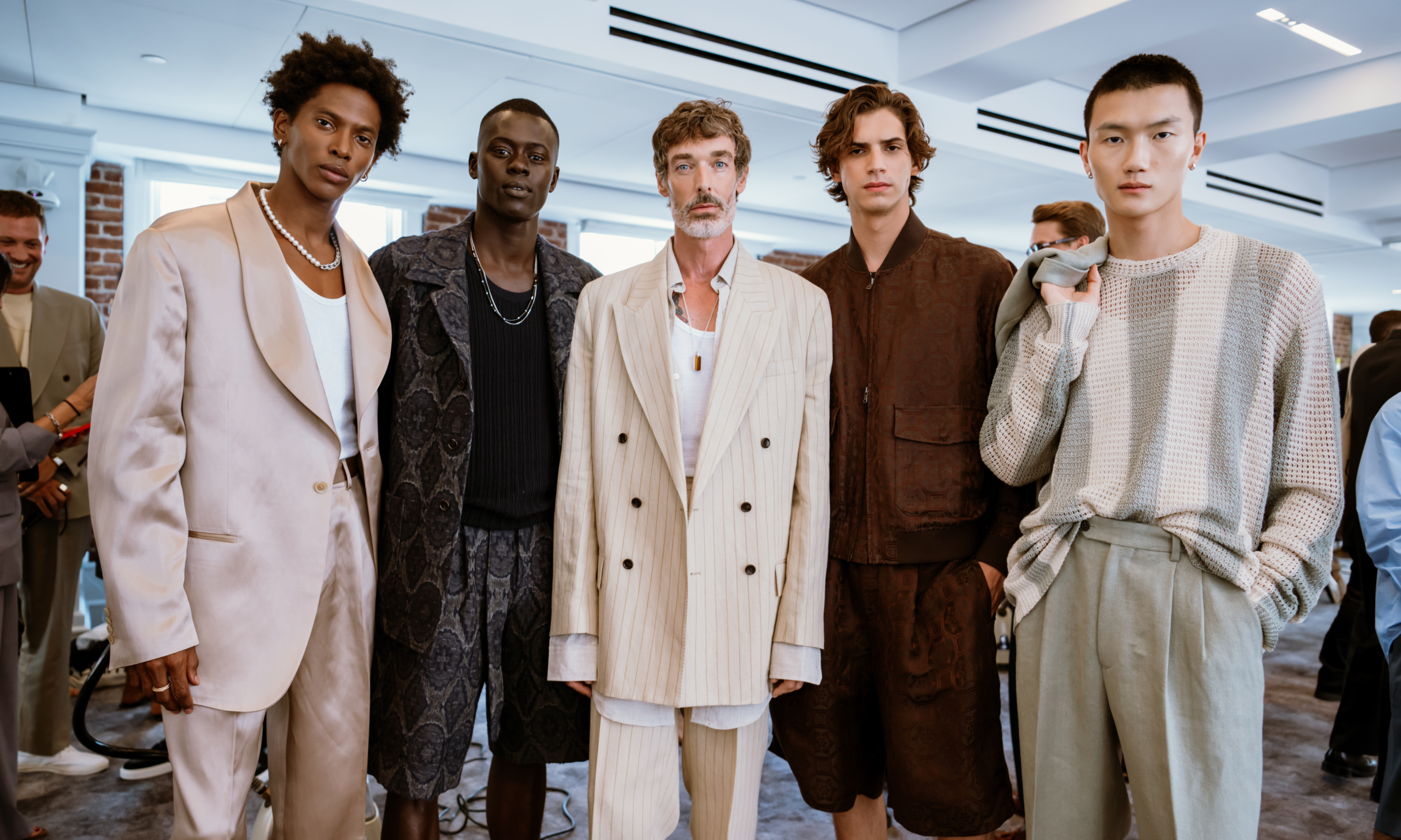 Five male models posing backstage before Todd Snyder's 2024 NYFW show