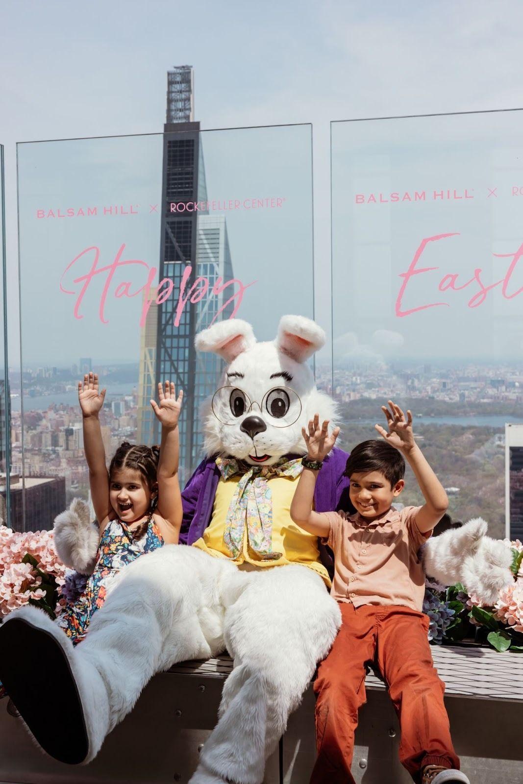 easter bunny sitting with kids at top of the rock