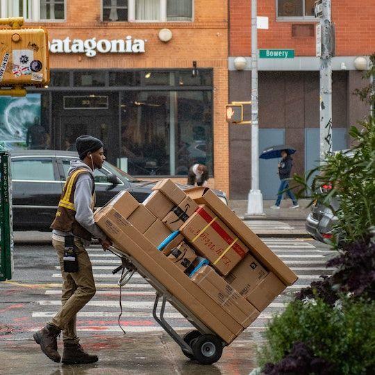Delivery person carrying packages