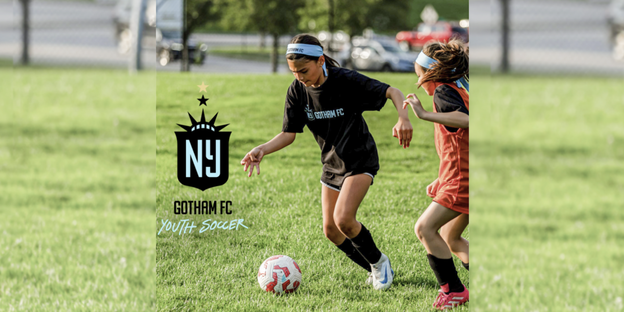 two girls playing soccer