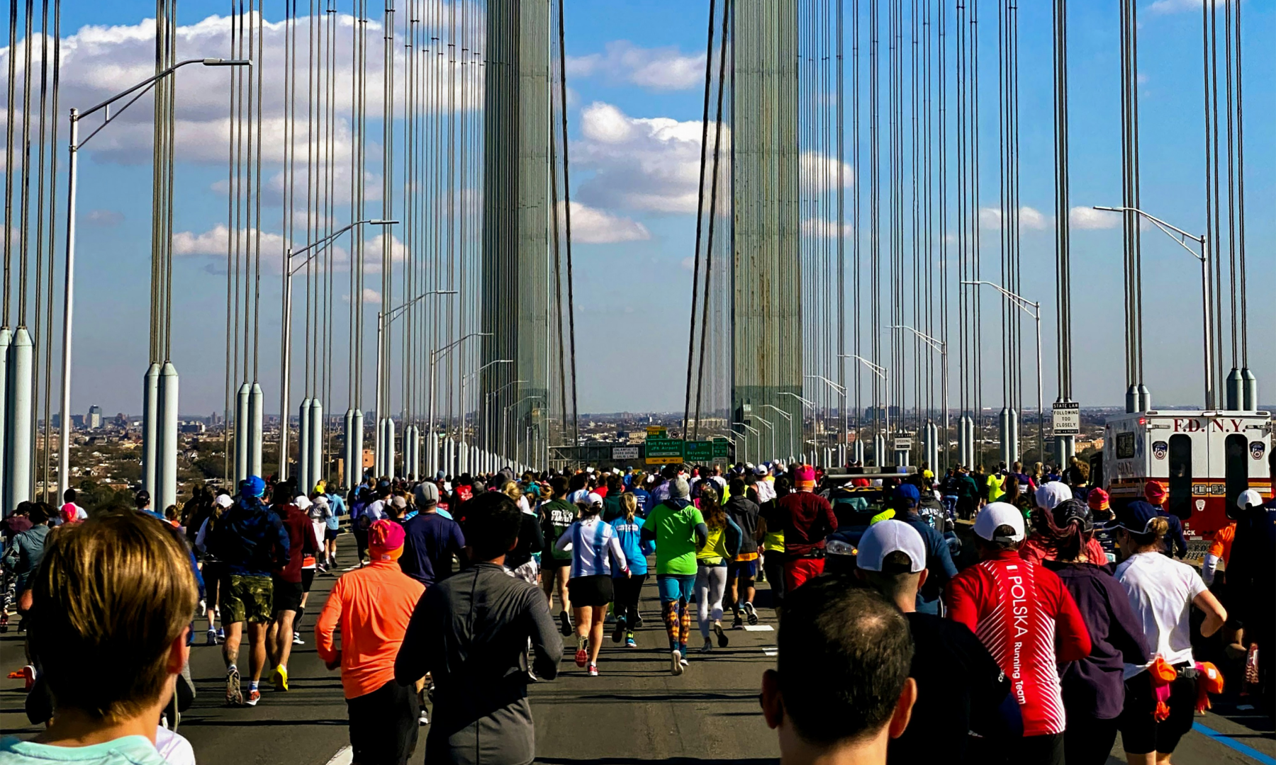A large group of people running the NYC Marathon