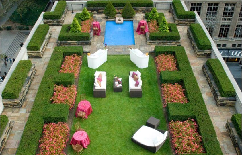 Rooftop garden with a reflecting pool and lounge seating