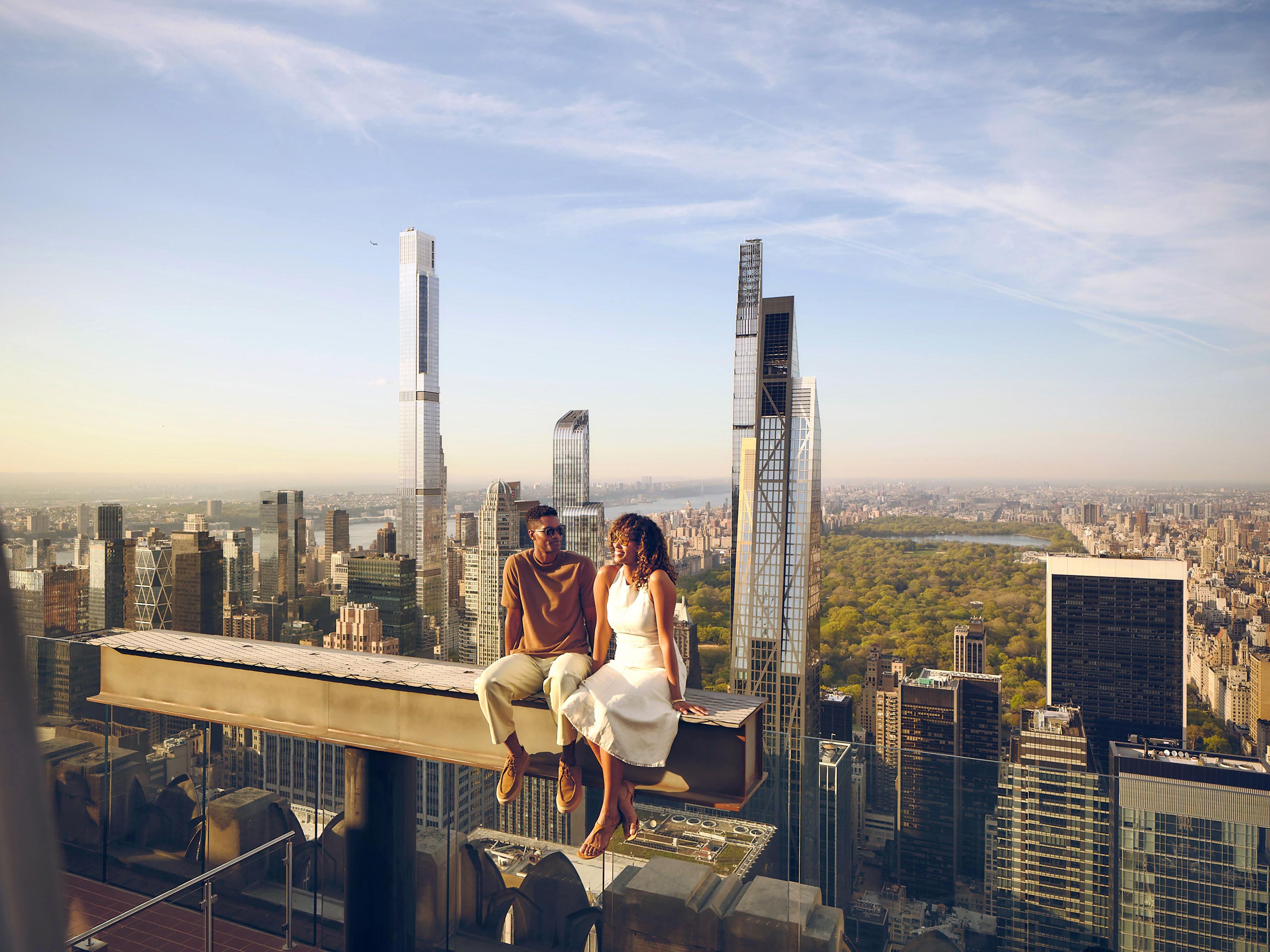 a couple on the beam experience at top of the rock