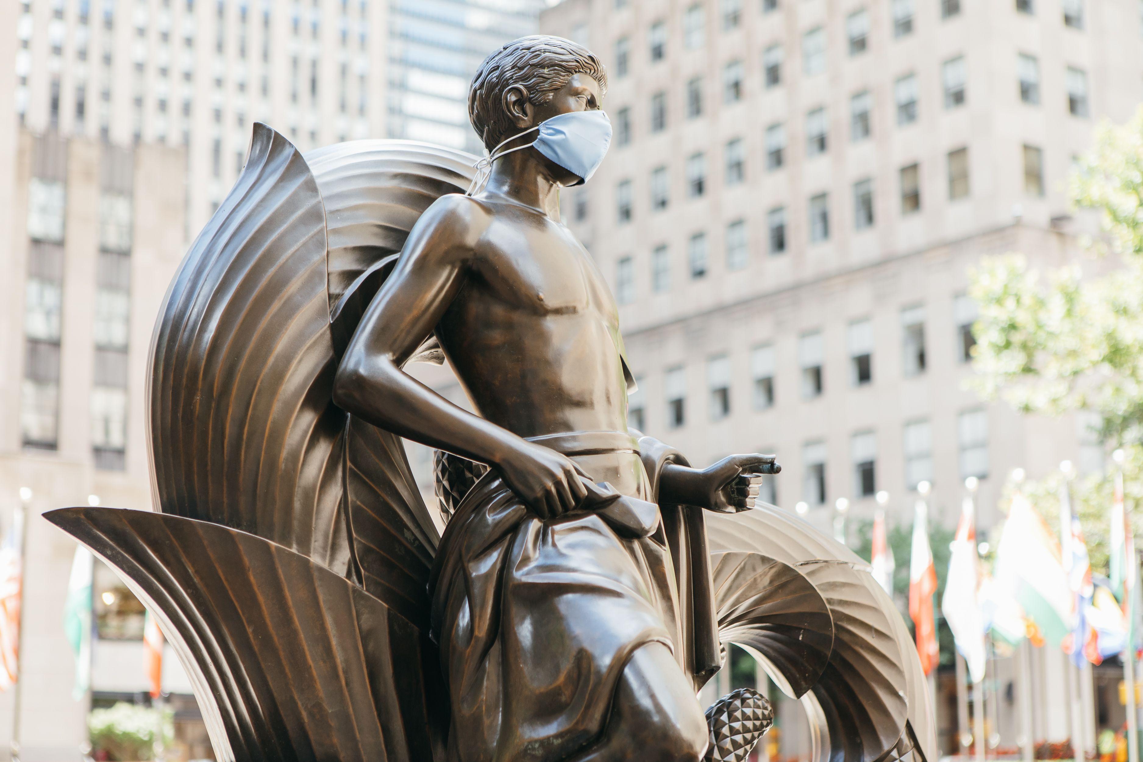 Sculpture with a mask on