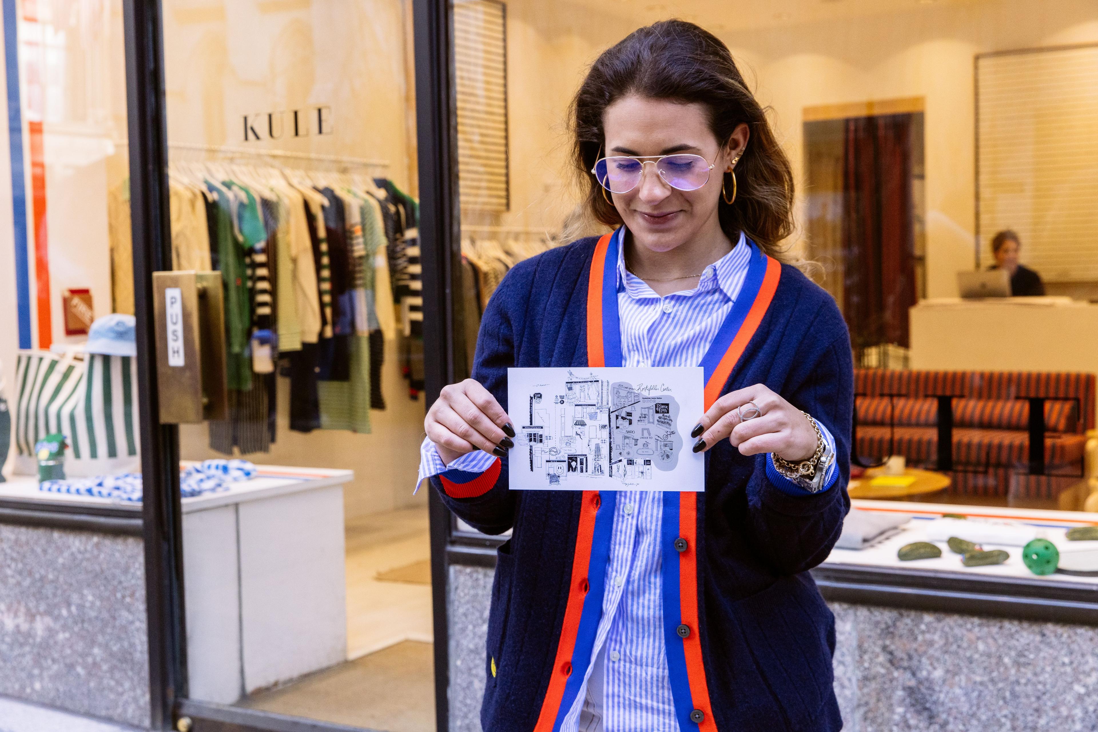 Person holding a map of women-owned businesses at Rockefeller Center