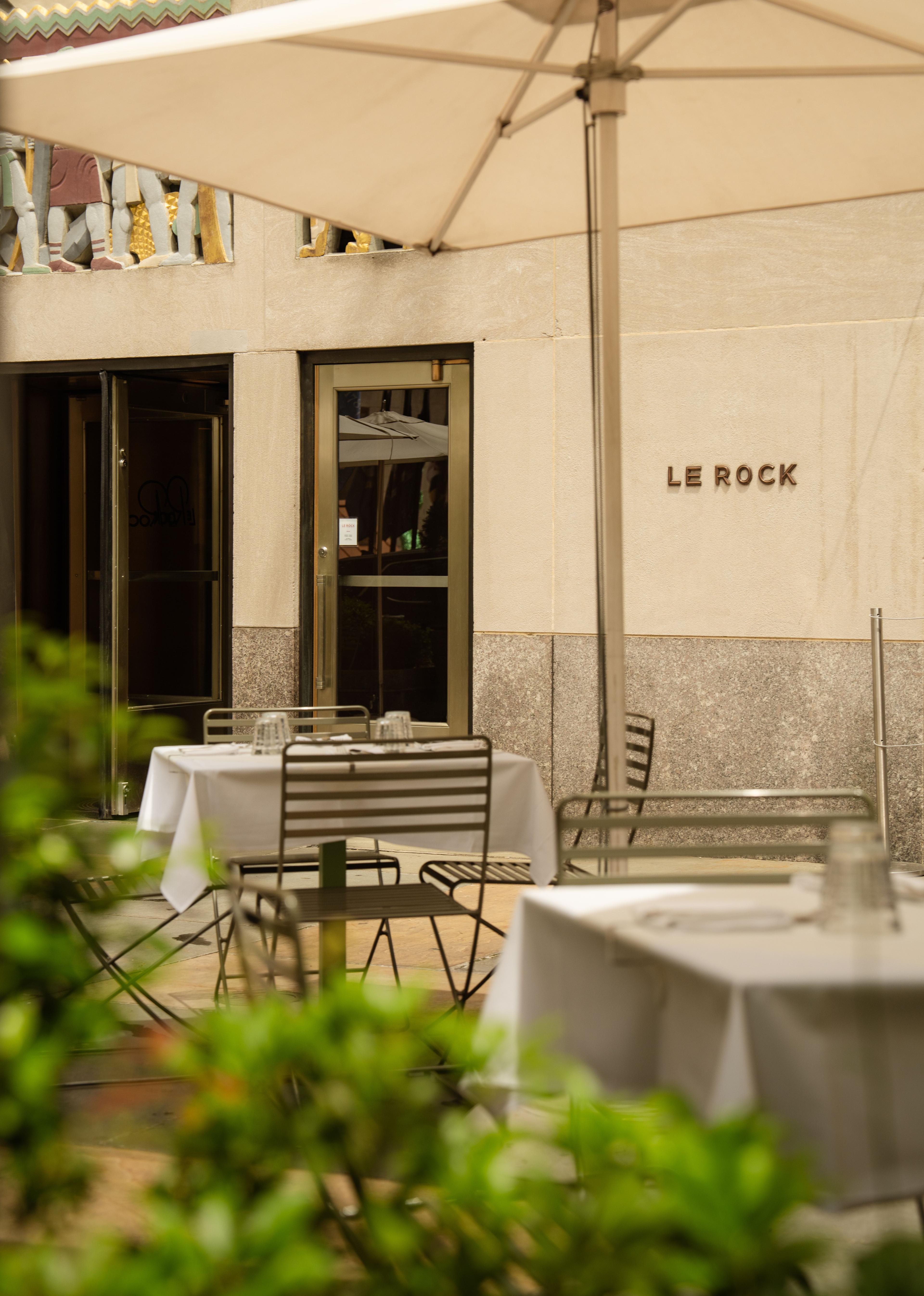 le rock restaurant exterior with tables and umbrellas
