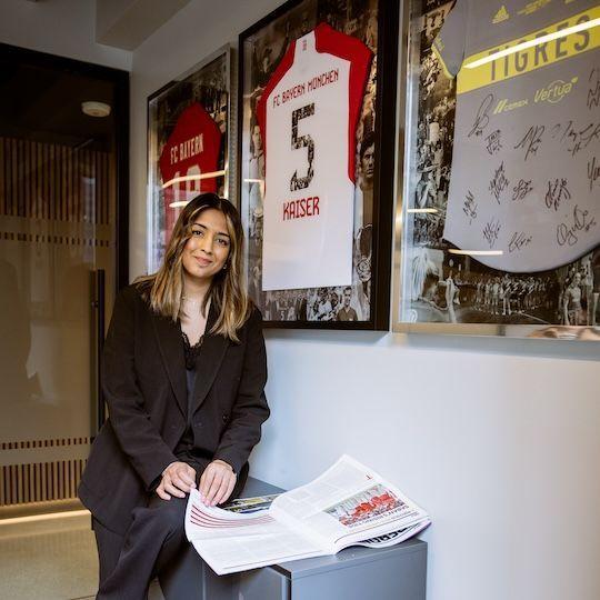 Managing Director (Americas) of FC Bayern Dee Kundra reading a paper in her office