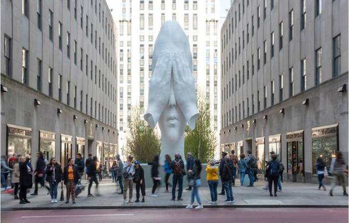 Jaume Plensa's Behind the Walls sculpture on display at Rockefeller Center.