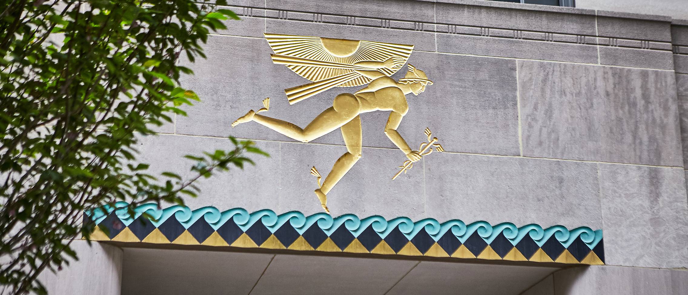 Photograph of Winged Mercury relief from Channel Gardens of 620 Fifth Avenue